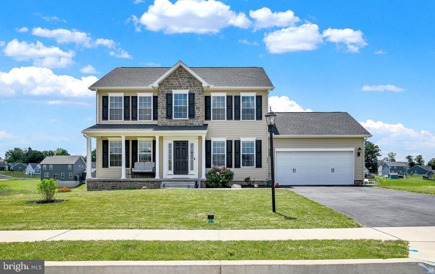 Nestled in the desirable Stonewicke Community of South Hanover, PA, 530 Ripple Drive is a beautifully designed Colonial-style home that exudes charm and modern sophistication. Built in 2022 and meticulously maintained, this home features a striking stone-front exterior, a covered front porch, and elegant architectural details that create timeless curb appeal.
Step inside to a bright and welcoming foyer, situated between a formal dining room and a formal living room, ideal for hosting gatherings or enjoying quiet moments. The center of the home, the well-appointed kitchen, boasts stainless-steel appliances, granite countertops, and a spacious island with bar seating—perfect for casual meals and conversation. The open-concept design flows seamlessly into the expansive family room, providing a warm and inviting space for relaxation. A pantry and a convenient half bath complete the main level.
Upstairs, you'll find four generously sized bedrooms, including a luxurious primary suite with cathedral ceilings, a spa-like en-suite bath with dual sinks, dual shower heads, a jetted tub, and an impressive walk-in closet. An additional full bathroom serves the remaining bedrooms, while a second-floor laundry room adds convenience to your daily routine.
Step outside onto the low-maintenance Trex deck, where you can take in the scenic backyard—an ideal space for outdoor entertaining or quiet relaxation. The spacious two-car garage provides ample storage, and the walk-out basement with a bathroom rough-in offers endless possibilities for future expansion. Plus, original builder warranties are still active and transferable!
Don't miss this incredible opportunity to own a like-new home in a fantastic community! Schedule your private showing today!