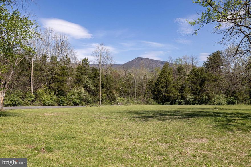 Rare opportunity to own three adjoining parcels totaling approximately 2.3 acres outside Luray and near the Shenandoah River. These mostly level, cleared parcels are ready for your future home, with well and septic already installed. Enjoy easy access via a well-maintained gravel road (by HOA) and take in scenic, year round views of Kennedy’s Peak. Improvements include a storage shed, covered storage area, and an additional outbuilding—ideal for equipment, hobbies, or extra storage. Peaceful setting, yet conveniently located to town and area attractions. Potential for short-term rental(s) (STR).