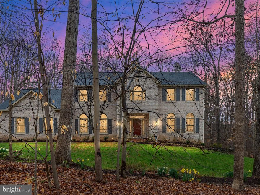 Welcome to this exceptional Colonial home, meticulously maintained and custom-built by the renowned Kuemmerle Builders. Nestled on over 2.5 acres of private, wooded land, this stunning 4-bedroom, 3-bathroom residence offers luxurious living with high-end updates throughout.
At the heart of the home is a beautifully remodeled gourmet kitchen, featuring a spacious center island, double ovens, a wine refrigerator, and top-of-the-line stainless steel appliances—perfect for both casual meals and elegant entertaining. Just off the kitchen, the inviting family room boasts a cozy gas fireplace, creating the perfect space for gatherings. Adjacent to the family room, a sunroom with skylights fills the home with natural light and leads seamlessly to an expansive composite deck and lower level patio, ideal for outdoor dining and relaxation.
The main level also includes a versatile office with built-in bookcases, which could easily serve as a fifth bedroom. A fully updated bathroom on this level enhances the home’s flexibility. The formal dining and living rooms are warm and spacious, featuring large picture windows that frame serene views of the surrounding trees.
Upstairs, the primary suite is a true retreat, offering a luxurious en-suite bathroom complete with a stand-alone soaking tub, double vanity, separate shower, and a generous walk-in closet. Three additional bedrooms are spacious and well-appointed, featuring fresh carpet, while the upper-level hallway boasts newly installed hardwood floors.
The walk-out basement is a blank slate, ready for customization with rough-in plumbing for a future bathroom—offering endless possibilities for additional living space.
Recent upgrades include a brand-new roof (2024), a new water heater (2024), and two new septic pumps (2025). The main level showcases refinished hardwood floors (2019), and the kitchen was tastefully remodeled in 2019, ensuring a modern and timeless appeal.
With its peaceful setting, expert craftsmanship, and thoughtful updates, this home is the perfect blend of privacy, comfort, and convenience.