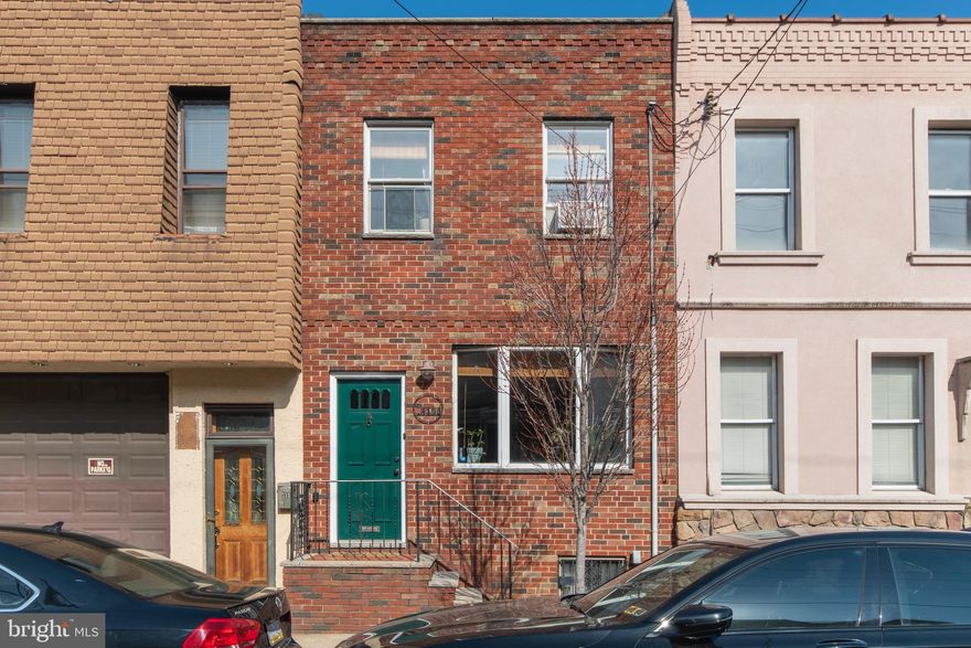 Chic 3 BR 1 Bath home in a great Port Richmond location!  This meticulously updated house is a mix of gorgeous 1920's craftsmanship & modern upgrades.  Enter the home though the vestibule that features original tiling and interior glass door. The open living area boasts original hardwood flooring through-out and a large bay window with built in shelving and marble ledge that drenches the space in natural light; a plant lover's dream.  Continue into the dining room/kitchen area.  Currently being used as an office/playroom,  the dining room offers many possibilities.  The fully renovated kitchen features ample cabinet space, an abundance of windows, stainless steel appliances, quartz countertops, modern white backsplash, a double farmhouse sink that overlooks the backyard, and breakfast bar; perfect for everyday living and entertaining.  Off the kitchen is a nice sized rear patio that has been thoughtfully curated and is a lush oasis when in bloom.  The second floor is home to 3 well-sized bedrooms and the bathroom.  The oversized primary bedroom is located at the rear of the home.  This space can accommodate a king sized bed, dressers for storage and also boasts a large closet.  The middle bedroom features original built-in storage and ample closet space.  The large front bedroom features a stunning built-in armoire and gets amazing morning and midday light.  The 3-piece bath was updated in 2020.  With white tiling, fixtures and wainscoting, the space feels bright and fresh.   The basement is home to the washer and dryer and offers additional storage.  The care taken to preserve the original details including the hardwood flooring, trim work, doors, and more is felt the moment you walk in this home.   With easy access to the 95 corridor and just a short walk toPort Richmond favorites like Lunar Inn, Gaul & Co. Malt House, Tacconellis, Nemi, a half block from Campbell Square Park and the shops on Richmond St, this home is not to be missed!