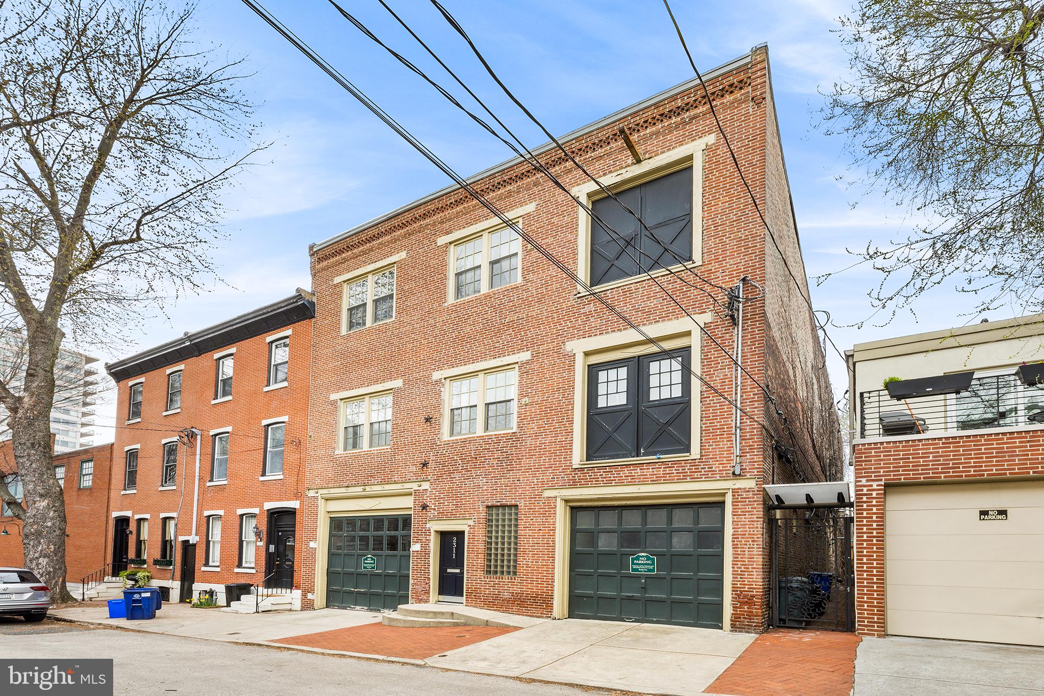 Boutique Corporate Headquarters? Grand Live Work Space? Amazing Family Compound? Multi Unit Redevelopment? Realize your vision with this amazing space that has been restored with three floors of spacious office space with original wood floors, exposed brick walls throughout, steel and wood beams, barn doors, high ceilings and an abundance of architectural detail. Vintage 19th century buildings in this condition are so rare in the highly sought out Fairmount neighborhood near the Philadelphia Museum of Art. Originally a brewery founded by Philip Klein, Sr. in 1863, later Fairmount Avenue Brewery in 1888 until 1916, Located on a quiet block, the buildings sits along bus route on 23rd Street with a paying parking lot one block away on Fairmount Avenue. There is easy access and walkability to Center City. There are two entrances (front of building and along a corridor on the right side of the building) as well as two garages. One garage fits one car and a larger garage accommodates at least three cars. The CMX-2 zoning represents an unbelievable opportunity to be creative and accommodate just about any vision you have in mind - from pure commercial to single family or multifamily. It is a three story office building with unbelievable opportunity to be creative with the space. The 1st Floor with open entrance way features private office, conference room, renovated kitchen, lounge area, expansive production space with cyclorama (with room to expand into current storage space, 3 bathrooms (2 powder room, 1 full), washer/dryer, rear yard and small basement. The 2nd Floor features a large lobby/common space with high ceilings, lots of light as well as 4 private offices that could be combined or used as currently configured (for podcast, video production, personal care, professional services), kitchen/conference room/lounge area, and 2 bathrooms (1 powder room and one full). The 3rd Floor could be single use or as set up now with large co-working space upfront, smaller front and rear offices and luxurious full bathroom. 2nd and 3rd Floors could be split and create bi-level office (s) and shared conference/kitchen. Split heating and air conditioning systems allow for total control. The entire building is open, airy and sun filled with natural light. Split heating and air conditioning systems allow for total control. The building is available for SALE or LEASE. Make your appointment today. You will not be disappointed.