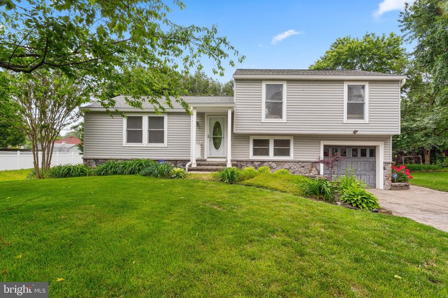 Fully renovated split level home in desirable Elmhurst!  This 4 finished level home offers 3 bedrooms, 2 full and 1 half bath and a 1 car garage with 240 volt electric vehicle charging station.  Spacious , open concept main level with dining room addition.  Updated kitchen with silestone counters, beautiful cabinetry and gas range opens to living room with fireplace.  Updated bathrooms with high end tile, vanities and lighting.   Custom blinds and California closet systems.  Lower level 1 makes a great den or rec room with a slider to back yard & garage access. Lower level 2 is finished and offers laundry, storage and great additional rec area.  Beautifully landscaped and hardscaped grounds with paver driveway.  Trex deck for entertaining in private rear yard.    New Hot water heater, newer roof and siding.  Ready to move right in! Conveniently located near shops, dining, Ft Meade and major commuter routes.  See the 3D tour! https://my.matterport.com/show/?m=rHQQh4BV3En&brand=0