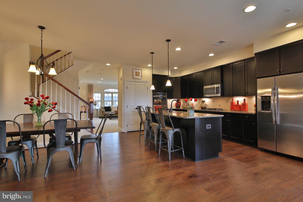 NEW CONSTRUCTION at Glenn Dale Crossing! August delivery Picasso condominium! $20,000 in closing cost assistance with the use of NVR Mortgage! Over 2,600 sq. ft in a very convenient location, just 3 miles to 295 & 495! Open and spacious floor plan- Lives like a Single Family Home! Large open kitchen with huge island, walk in closets, BR level laundry and much more! 3 bed, 2.5 bath, 1 car garage and 1 parking pad. Images are representative. Other homes sites available. SALES: M 1-6, Tu -F 11-6, Sa 11-5, Su 12-5. GC202H