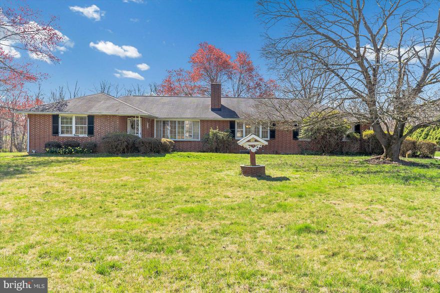 Welcome home to this stately custom built all brick rancher in Woodstock! This home features four bedrooms and two and a half bathrooms, main level living, two fireplaces back to back, large basement room ready for all of your entertaining, three flat acres of private land, and a long private driveway. Just off of Marriottsville Road this home is close to parks, restaurants, school and commuter routes. With the quiet and serene lot not far from Randallstown or Eldersburg this home has it all! Schedule your private tour today, before it's too late!