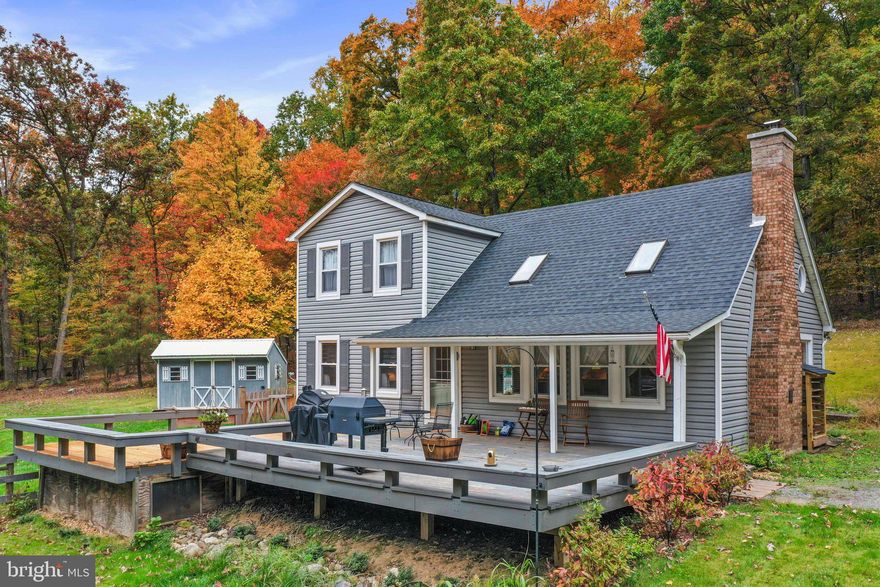 Multiple offers have been received.
 !!!!!!!!!!!!!! OFFERS HIGHEST AND BEST  ARE DUE TUESDAY THE 10TH  BY 3 PM!!!!!!!!!
If you are looking for private, secluded, and peaceful scenic views with wild animals in your backyard this may be what you have been looking for!!! This charming home is tucked away at the end of the road bordering Cacapon State Park.   This home features many upgrades such as newer windows, a water heater/water softener, bathrooms, a kitchen,  and a Trane heat pump.   Come enjoy yourself in this beautiful inviting cozy vaulted family/dining room with beams, skylights, and a working wood-burning fireplace.   Take a look at the unique space the owner has utilized for her spices and for extra storage space behind the spice rack.  The primary bedroom is on the main level and full bathroom with a laundry room.  The upstairs has the other 2 bedrooms and a full bath.   For your enjoyment outside you have two large decks for entertainment or grilling!!  There are also Apple trees planted on the property.  The well motor and the bladder were replaced in 2022.   Frontier Internet is available.   The 0-turn mower and the push ATV mover convey.  This home with a 3.6-acre unrestricted lot and no HOA could be yours, call to make an appointment today!