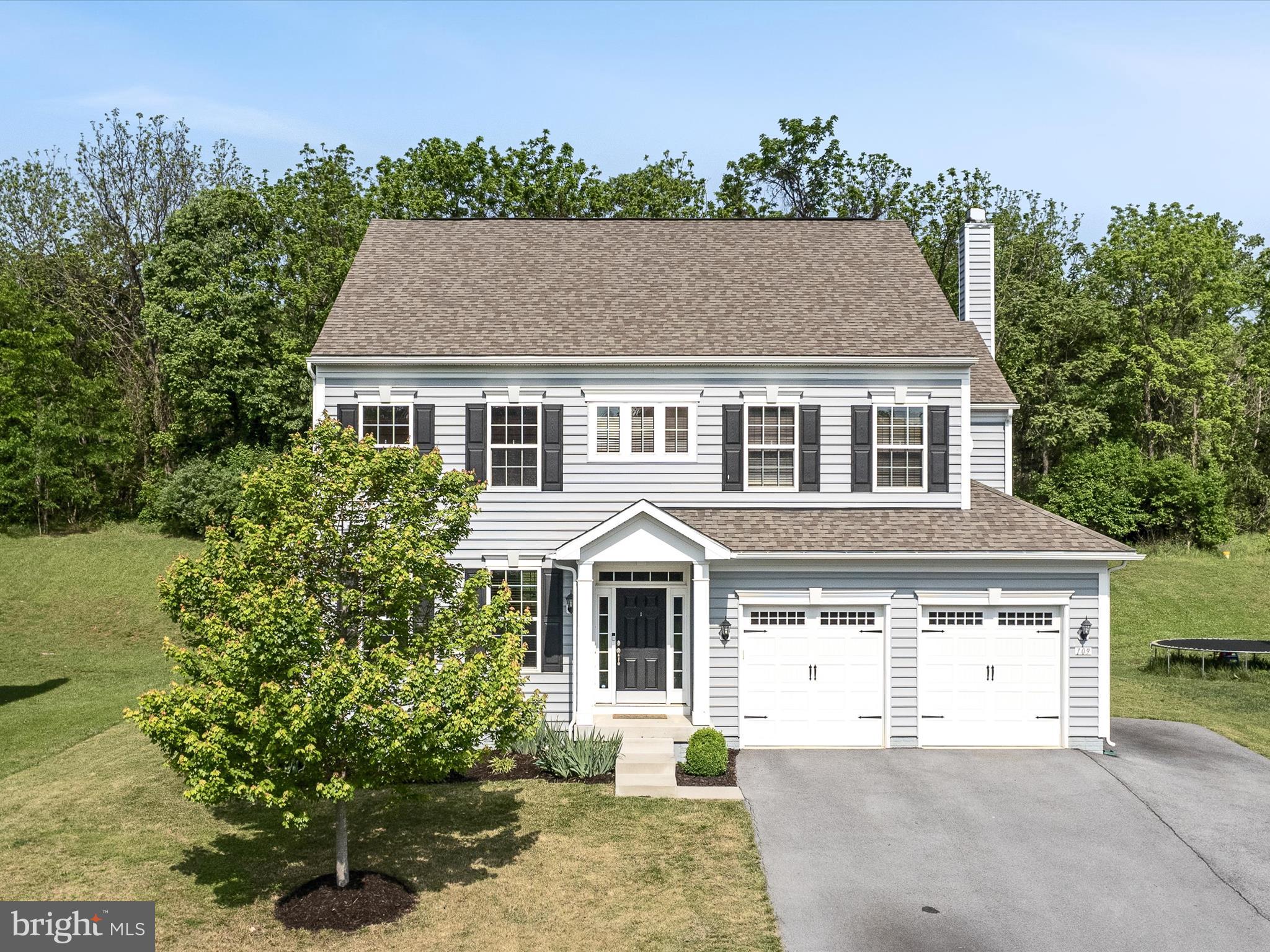 This beautifully maintained, move-in ready stunner boasts 4 bedrooms, 4.5 baths, and over 4,900 total finished square feet across three spacious floors—perfect for spreading out, entertaining, or simply living your best life. Welcome to your dream home in Sheridan Estates, Harpers Ferry, WV! Built in 2018 and sitting on .40 acres, this home is packed with upgrades and thoughtful design. The main level wows with hardwood flooring, a stylish foyer with open oak stairs and iron balusters, and elegant formal living and dining rooms enhanced by crown molding, columns, and chair rail accents. The gourmet kitchen features an electric cooktop, wall oven, island, stainless steel appliances, granite countertops and opens to a light-filled morning room with vaulted ceilings and sliders to the patio. Cozy up in the family room with a wood-burning fireplace and stunning floor-to-ceiling stone hearth. Upstairs, the primary suite is your private oasis with tray ceiling and a sitting area, spa-like bath (soaking tub, walk-in shower, dual vanity), and two California closets that make organizing a breeze! Bedroom 4 has its own private bath and walk-in closet, while Bedrooms 2 & 3 share a sleek hall bath. The finished lower level offers endless possibilities—think in-law suite or guest retreat—with a rec room, exercise room, full bath, and a full second kitchen with granite countertops, appliances, and French doors that open to the backyard. Just minutes from historic Harpers Ferry, Potomac River, hiking trails, schools, shopping, and major routes to MD, PA, VA—this location is unbeatable.
