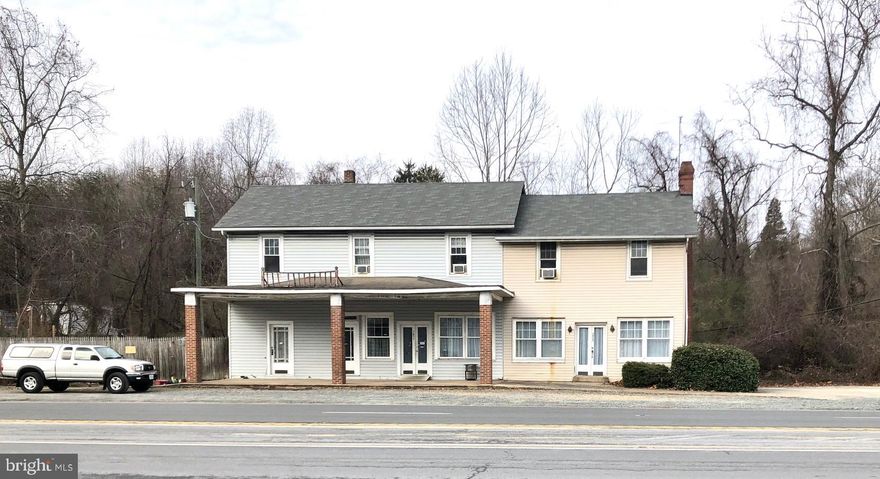 Commercial building on .65 acre lot at intersection, zoned B2. Two apartments currently rented; 1 at left rear is efficiency in pics, 1 at top right has separate LR and BR. Office space has 3 half baths, but only 1 was being used.  Not sure if the square footage on the tax record is accurate. B-2 Urban Commercial. The purpose of the B-2 district is to designate appropriate areas for high-intensity commercial uses intended to serve retail sales and service, business and professional service needs at a regional or countywide scale. These areas should be located at strategic nodes along arterial and major collector roads where there are adequate utilities and facilities to serve intense development.
