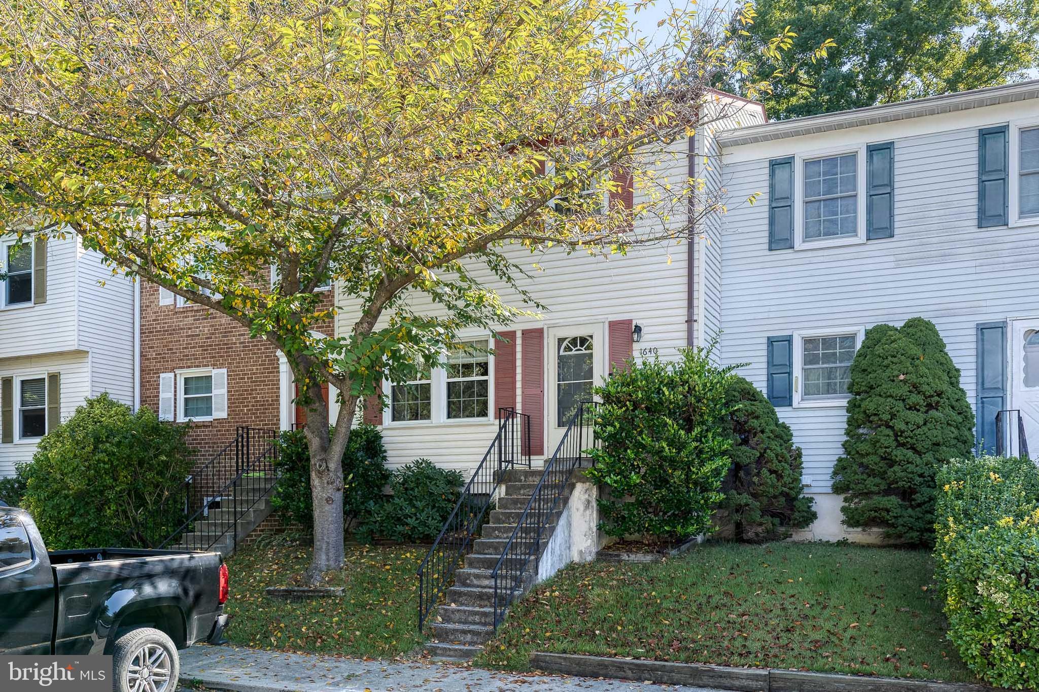 Welcome to Mount Airy Court, nestled in the highly sought-after Crofton Meadows community! This beautifully updated townhome is freshly painted in a modern, neutral tone and is truly move-in ready. Enjoy the convenience of two assigned parking spaces right outside your front door, plus ample guest parking nearby. Step inside to discover a fully renovated kitchen featuring rich espresso cabinetry, a custom tile backsplash, granite countertops, stainless steel appliances, an industrial-style sink and faucet, and an abundance of storage. The spacious eat-in area flows seamlessly into the kitchen—perfect for entertaining. The main level offers an open-concept living and dining area, along with a stylish powder room for guests. Upstairs, the deluxe primary suite boasts generous closet space and a private en-suite bath with an updated, tiled shower. Two additional bedrooms are well-sized with great closets and share a full hall bathroom. The fully finished lower level features a custom built-in bar—ideal for a rec room, game room, or home office. Outside, you'll find a fully fenced backyard complete with raised garden beds—a perfect spot for gardening enthusiasts or simply enjoying the outdoors. Don’t miss this opportunity to own a move-in ready home in one of Crofton’s most desirable neighborhoods!