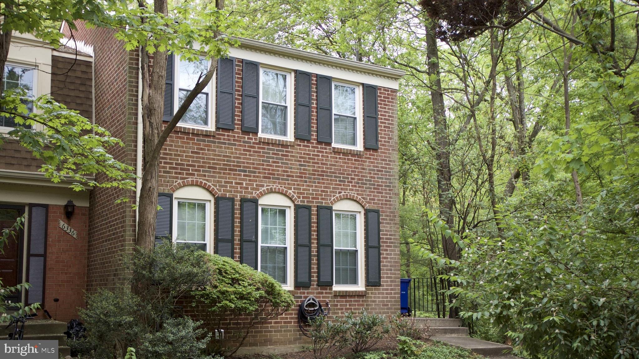 Updated Brick End-unit in natural setting but convenient to shopping and commuting routes. Refreshed inside and out featuring 3 bedrooms, 2 full baths, 2 half baths, Table-space Kitchen, main level Deck, and a Family Room and Walk-out to rear yard. One assigned parking space near front door and additional unassigned space available.