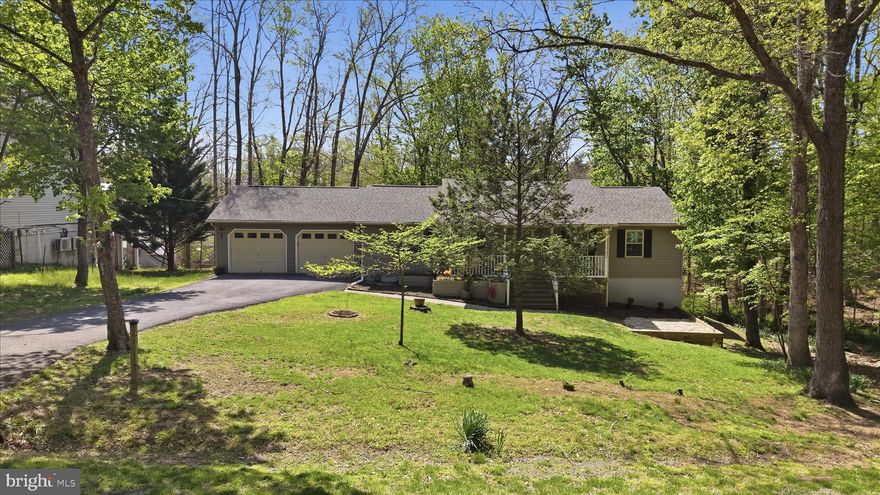 GATED LAKE COMMUNITY LIVING – VACATION YEAR-ROUND! Welcome to Lake Holiday, where resort-style living meets everyday comfort! This move-in ready 3BR/2BA rancher offers easy one-level living with the added bonus of a partially finished walkout basement—perfect for a rec room, theater, or game-day space, plus unfinished area for storage or future expansion. The kitchen shines with rich cherry cabinetry, granite countertops, and a breakfast bar ideal for gathering. The spacious primary suite features a private bath with a new vanity, and the oversized 2-car garage provides room for your boat, lake gear, or extra storage. Unwind on the covered front porch or entertain on the back deck—your own private retreat. Major updates are already done: new roof & gutters with gutter guards (2020) and new dual-fuel HVAC (2024), along with a new range, hood, and garage door openers.
Enjoy life inside this sought-after gated lake community featuring a 240-acre lake, marina, boat ramp, sandy beaches, clubhouse with fitness room, fishing pier, playgrounds, walking trails, sports courts, dog parks, and boat/RV storage. Bring your boat and live the lake life every day!