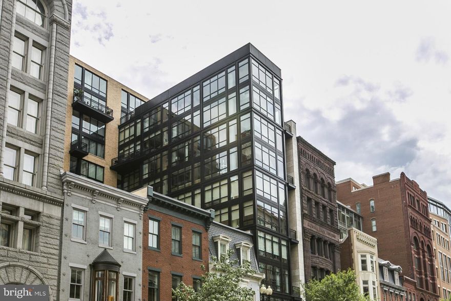 Featured in Home & Design Magazine!! This all glass 4 level residence maintains a distinct identity on each level. Main entry includes an airy kitchen with custom-designed cerused white oak cabinetry and a welcoming steel fireplace! Master suite includes an open-plan master bath with a dramatic stone soaking tub! Elevator, roof deck, wine refrigerator!, wet bar & more!!!