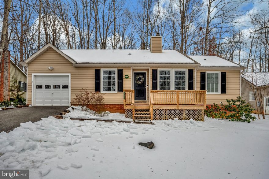 Discover this charming ranch-style home nestled in the desirable Lake of the Woods community. This well-maintained residence features 3 spacious bedrooms and 2 full bathrooms, including a luxurious walk-in shower. The open floor plan is enhanced by recessed lighting and ceiling fans, creating a bright and inviting atmosphere. Enjoy the convenience of an eat-in kitchen equipped with modern appliances, including a built-in microwave, dishwasher, and electric stove. The interior boasts plush carpeting and luxury vinyl plank flooring, ensuring comfort and style throughout. A cozy wood-burning fireplace adds warmth to the living area, perfect for relaxing evenings. The main floor laundry adds practicality to your daily routine, while the walk-in closets provide ample storage. Step outside to a partly wooded lot of 0.34 acres, offering a serene setting and a screened porch that invites you to enjoy the outdoors.  Community amenities include two pools, a fitness center, and various recreational facilities such as tennis & pickleball courts and walking paths. With an attached garage and additional driveway parking, convenience is at your fingertips. This home is not just a residence; it’s a lifestyle choice in a vibrant community with endless opportunities for leisure and recreation. Don’t miss your chance to make this property your own!