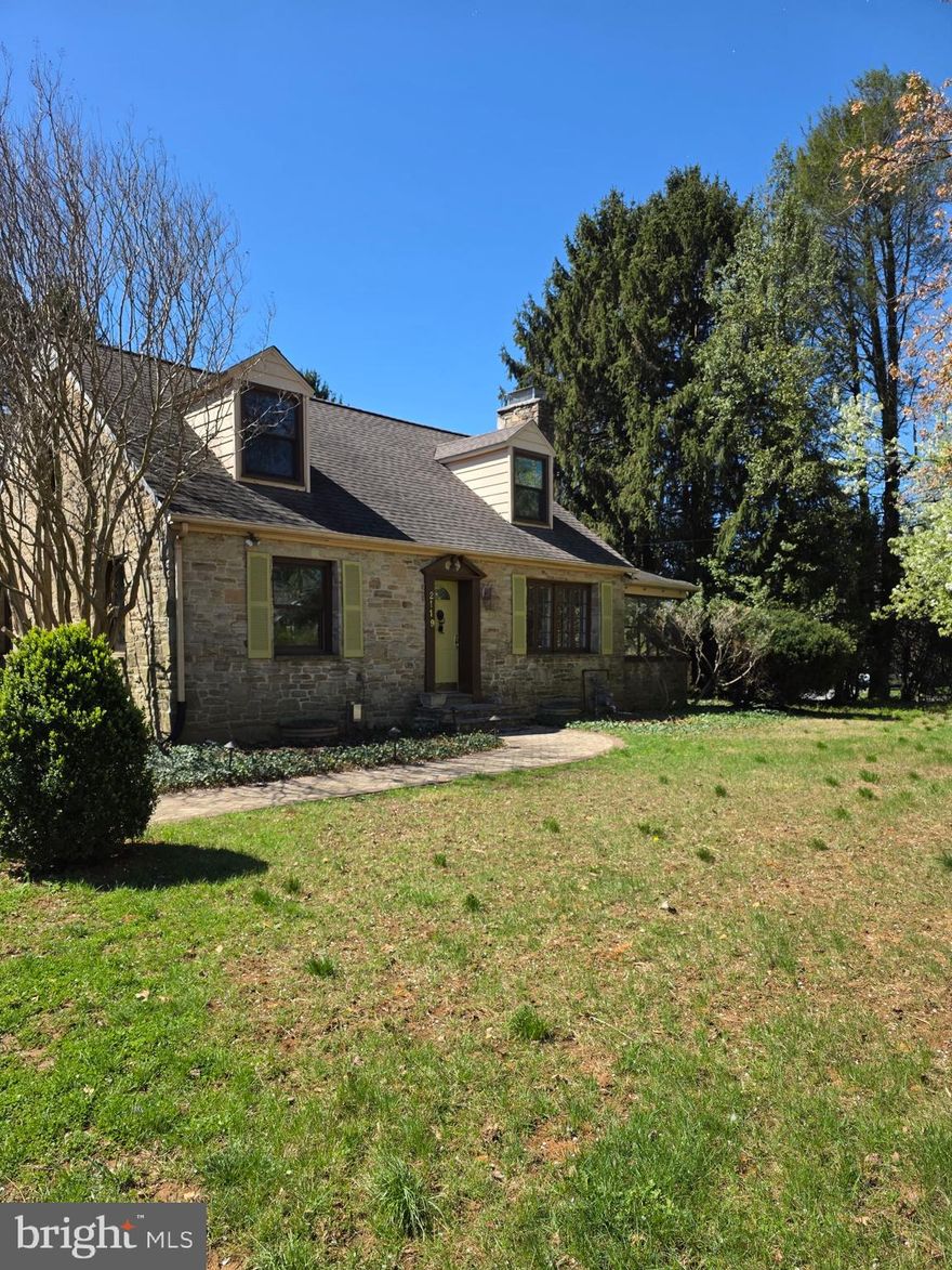 Discover the charm of this classic stone Cape Cod nestled on nearly half an acre of land. Freshly painted and full of character, this home blends timeless aesthetics with modern updates. The kitchen boasts sleek stainless steel appliances and opens to a covered porch, perfect for enjoying your morning coffee while overlooking the expansive, oversized backyard—ideal for gardening, play, or entertaining.  The backyard also offers a covered patio that overlooks the backyard.

With four bedrooms (two on the main level and two upstairs) and three fully updated bathrooms, there’s room for everyone to spread out. The first-floor bathroom has been tastefully refreshed, while the second-floor bathroom is brand-new ( 2026). The second floor also features a spacious sitting area adjacent to the bedrooms, offering a cozy spot to unwind, read, or enjoy a quiet moment. The inviting living room showcases a cozy stone  wood fireplace and French doors that open to a multi-season sun porch, offering a peaceful retreat year-round. The adjacent dining area provides a welcoming space for gatherings.

The recently renovated basement  2026)adds even more versatility with NEW carpet, fresh paint, a NEW bathroom, and a large utility room with ample storage. Situated on a corner lot and conveniently close to all commuter routes as well as shopping and dining, this property perfectly balances classic charm, modern comfort, and unbeatable location. Don’t miss your chance to call this one home!