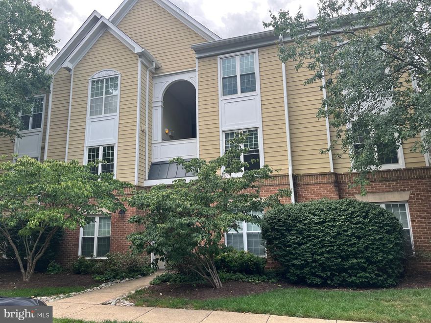 Location, Location, Location!! This place is close to everything. The new Silver Line Herndon-Monroe metro station is only 1/2 mile away, Dulles Airport is an 8 minute Uber/Lyft ride away, and tons of shopping and entertainment within minutes.  Not only is this a great location it has the largest floor plan of all the Worldgate condos.  This two bedroom, two bath condo has fresh paint, newer appliances, gas fireplace, and a Culligan water filtration system.  Sip your morning coffee while sitting on your trex deck with a view of the flowering trees and one of the two community pools.  This community also boasts an exercise room and a club house.  All of these amenities, along with trash, water, and your own parking spot, are included with your low condo fees. There is also ample additional parking spaces available. Come see it soon before it is gone.