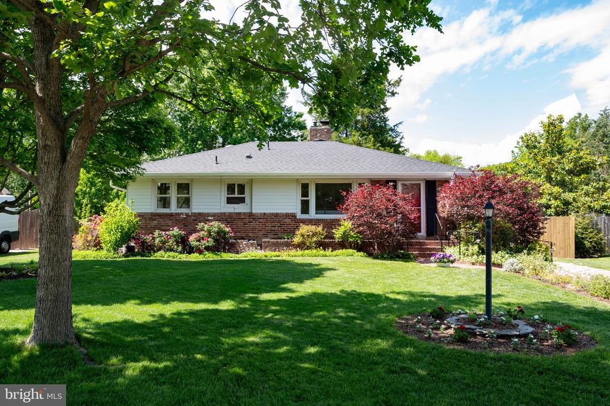 This beautifully updated and expanded two-level rambler in Hollin Hall Village offers the perfect blend of charm, comfort, and convenience. Located in the highly sought-after Waynewood Elementary School district, the home features four bedrooms and three full bathrooms, with all bedrooms situated on the main level. The primary suite addition offers an en-suite bathroom and peaceful views of the patio and lush backyard. The main level also showcases newly refinished hardwood floors, a spacious living area with a wood-burning fireplace, a dining space, and a bright kitchen with newly refaced cabinets, new microwave & fridge, new dishwasher 2024, ample counter space, and generous storage.

Downstairs, the expansive lower level provides an ideal entertaining space along with a third full bathroom, a laundry and work room, and abundant storage. A few steps up from the lower level lead to the fully fenced backyard, a haven for relaxing, entertaining, or gardening—with strawberries nearly ripe and pears and figs soon ready to harvest.

Additional updates include a replaced roof and gutters in 2024 and energy-efficient double-pane windows. The home’s location is truly unbeatable—just a short walk to the Hollin Hall Shopping Center, which includes a Safeway, hardware store, pastry shop, variety store, and several dining options. Outdoor lovers will appreciate easy access to the George Washington Parkway and Mount Vernon Bike Trail, while commuters benefit from proximity to Fort Belvoir, Huntington Metro, and Old Town Alexandria. This home truly offers the best of neighborhood living with modern updates and exceptional convenience.