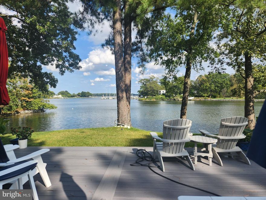 Experience waterfront living at its finest in this remarkable St. Michaels retreat, where breathtaking water views define every moment.  The beautifully remodeled main level was designed to maximize the scenery, seamlessly blending indoor comfort with the natural beauty beyond.  A chef-inspired kitchen with Monogram stainless steel appliances anchors the open-concept living space, perfect for entertaining.  Gleaming hardwood floors enhance the home's inviting ambiance. The primary suite is a serene escape with a stunning bath, while the upper level offers generous space ready to be transformed to match your vision.  Outside, the property unfolds into a private waterfront playground, complete with a charming cottage ideal for guests or extended family, and a detached two-car garage with a one-bedroom apartment awaiting restoration.  Bring your imagination! An exceptional opportunity for boating, entertaining, and relaxed coastal living.  Just minutes from fabulous restaurants, boutique shopping, and the quaint charm of St. Michaels.