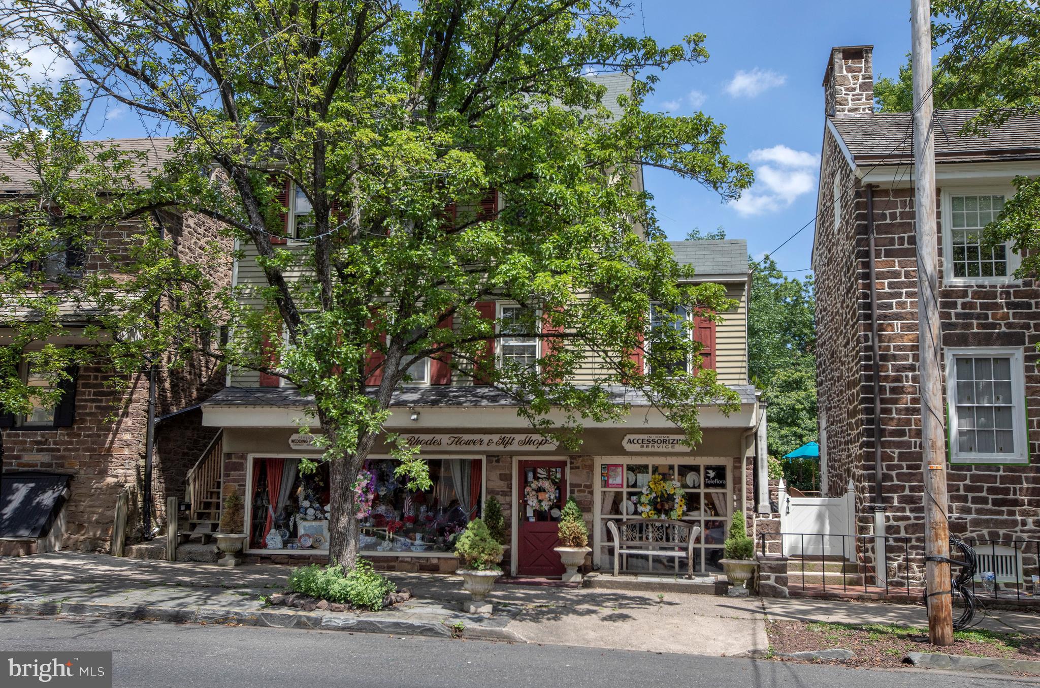 In the center of downtown historic Newtown Borough, located by the corner of one of the primary intersections and across the street from Starbucks sits this great investment or owner-operator opportunity: The Torbert House, circa 1795. Enjoy tons of foot traffic and large display windows in the main storefront, which has been a popular flower shop for decades, with over 2,800 SF of retail & back office space including a bright, multi-story solarium/atrium with brick floors and loft. Join the booming local growth including the Steepleview Project (110 luxury condos) and other major-draw tenants (retail, food, and entertainment) that are flocking to the area. Passive income from the second floor 3 Bedroom apartment (currently occupied) offsets costs or could offer additional back office or owner’s residence. Located close to the municipal parking lot, this location can cater to both tourists and locals alike, and is convenient to Route 332 and I-295 (formerly I-95). Do not approach the occupants or show without an appointment. ALSO AVAILABLE FOR LEASE