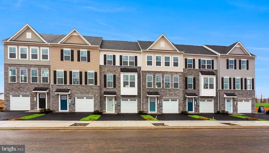 Welcome to the to-be-built Ballad at Madison Greens—a home designed for those who want more space, more flexibility, and smarter long-term value without stretching their budget. With nearly 2,000 square feet across three finished levels, this townhome lives larger. The entry level recreation room creates a versatile space perfect for today’s flexible lifestyles. Upstairs, the open main level is designed for everyday living and entertaining, featuring a bright great room, an expansive kitchen with a generous center island, walk in pantry, and a dedicated dining area. The private backyard adds outdoor space rarely found in townhomes and provides room to relax, grill, or let pets play. Upstairs features a spacious owner’s suite with dual walk in closets and a private bath, along with additional bedrooms and convenient bedroom level laundry. Located just minutes from Route 9, shopping, dining, and commuter routes to Maryland and Northern Virginia, this home offers a rare combination of space, location, and new construction peace of mind—making it not only a comfortable place to live now, but a smart investment for the future. Come visit our model home at: 1741 Destrier St, Ranson, WV, 25438