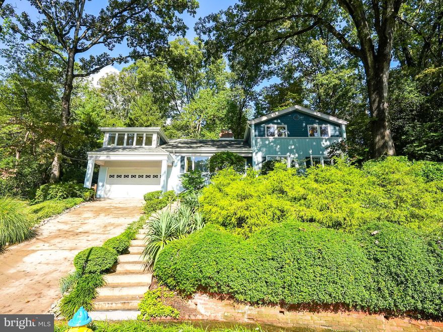 Welcome Home to Bellevue Forest’s Mid-Century Gem!  Situated at the end of a cul-de-sac on a hill with a beautiful view of the neighborhood.  This spacious and unique 6-bedroom, 3-bathroom, 1-office, mid-century modern home, with art deco inspiration, offers extraordinary living in the heart of North Arlington. With a highly sought-after attached Garage, large enough for 2 cars, and a thoughtful layout, this home is designed for both comfort and space.
Gourmet, eat-in, kitchen, with mid-century modern style, featuring stainless steel appliances, 6 burner cooktop, wall oven, and microwave—great functionality designed for culinary enthusiasts.
Shared living spaces are traditional yet expansive with Hardwood Floors. The first-floor living room includes a wood-burning fireplace, brightly lit sunroom, and a formal dining room. Convenient access to two private patios directly from the first floor adds a wonderful indoor-outdoor flow.
Also on the first floor is a spacious master bedroom with abundant closet space and an ensuite bath.
Head upstairs to 3 more spacious bedrooms, a bathroom, a large office space, and the second-floor family room. Relax in the knotty pine-paneled chalet-style family room, complete with a gas fireplace and access to a large outdoor patio.  
Walk through the office to the additional mother-in-Law Suite: This unique layout offers a separate area with 2 bedrooms and a full bath—ideal for guests, teens, or as a private retreat.  This space is also accessible from the sunroom.
The entire home is hard wired for Ethernet connection and the kitchen includes 2 Sonos speakers.
This home is complete with a true outdoor oasis.  Over $30,000 was invested in water management French drains, hardscape, pathways, and landscaping. This serene dream includes 3 connected patios and intricate, well-designed landscaping. The large .33 acre lot includes beautifully maintained fauna, mature trees, and beautiful pathways. Whether you're hosting gatherings or enjoying peaceful solitude, this outdoor space is a serene sanctuary.
