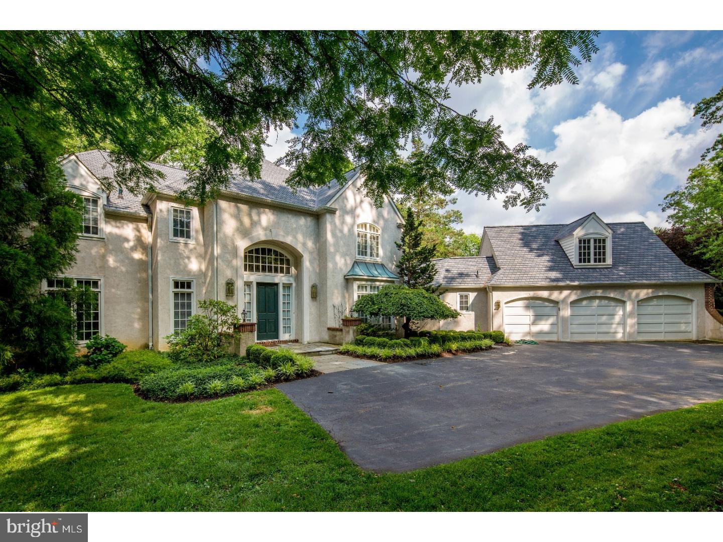 What more could you want than a stunning French Colonial with 5 bedrooms, 4 full and 2 half baths, in an outstanding location with direct access to it all! This awe-inspiring 5,842 SF home fulfills your love of luxury and desire for a central address near schools, the train station, transportation, shops, restaurants, houses of worship, and the Merion Cricket Club. A family dream home on nearly an acre in the desirable north side Haverford neighborhood! From the exquisite grounds and from every room you'll enjoy picturesque views and private environs. Wherever you are inside, oversized windows invite in soaking light and bring the outside in. Welcoming you is an airy 2-story reception hall featuring hardwood flooring with decorative inlays. French doors open to the customized library with wood paneling, built-ins, a fireplace, crown moldings and wet bar. Another set of French doors open to the sunroom where you can enjoy nature's beauty. The sunroom can also be accessed by the spacious living room, creating a seamless flow. The large step-down living room sits off the reception hall with columns framing its entrance. A fireplace with slate surround is flanked by double rear-facing windows with cushioned window seats. The large, light-filled dining room leads out to the wraparound deck for easy indoor-outdoor entertaining. The renovated gourmet kitchen is a magnet for the entire family. The chef will particularly love the functionality and style, with Kraft Maid cabinetry, granite countertops, tiled backsplash and flooring, a walk-in pantry and top-grade Viking, Sub-Zero and KitchenAid appliances. Other favorite spots are the sunny breakfast room off the kitchen, and the amazing vaulted family room with a fireplace, double skylights, and glass sliding doors to the deck. A mudroom offers entry to the laundry room with cabinetry and a utility sink, as well as to a powder room, pantry and 3-car garage. You'll surely be wowed by the master suite with a vaulted ceiling and wall of cabinetry. His and hers closets provide ample room for storage. The marble master bath is a spa-style retreat with a Whirlpool tub, separate shower, water closet with bidet and double-sink vanity. Two additional bedrooms, a full hall bath and second huge bedroom suite occupy the second floor. The finished day-lit lower level with its own entrance presents another BR suite plus rec room with fireplace, wet bar, glass doors to the rear, and an unfinished area for storage.