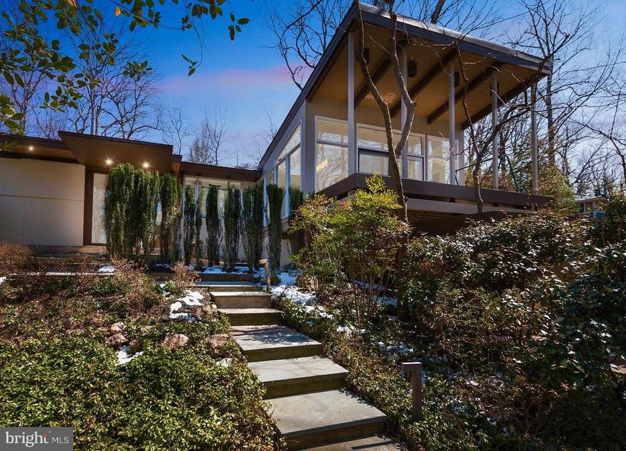 Spectacular Frank Lloyd Wright style home enlarged, rebuilt and renovated custom crafted w/ finest inc. Chinese sandstone, marble & Oak flrs, Quartz, redwood, brick & stucco. Mahogany cabinetry & built ins designed by architect & cabinetmaker. Soaring ceilings & windows & walls of glass provide vistas of gardens, speciman trees, wildeflowers and 100's of azaleas. Whitman Schools!