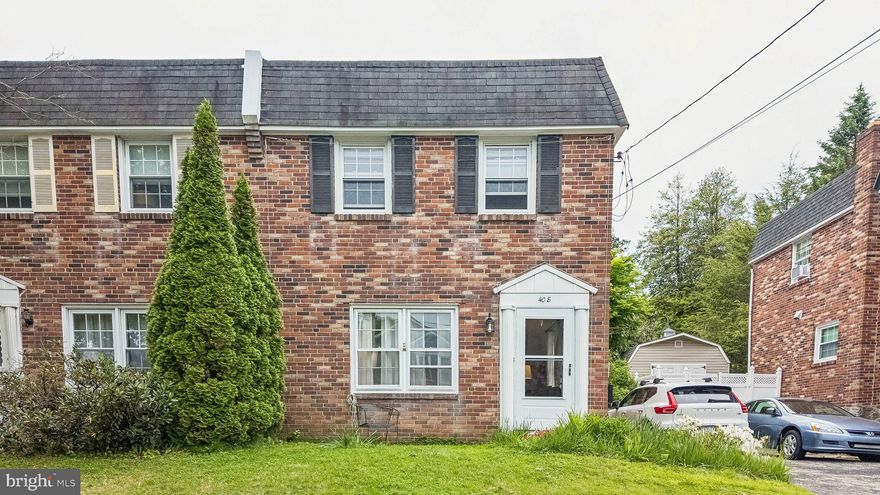 Located on a corner lot in the heart of Narberth, this classic all-brick twin offers the kind of location and everyday livability that makes people fall in love with the neighborhood in the first place. Walk to downtown Narberth in just minutes for the train, movie theater, parks, restaurants, shops, and everything else that gives this small Main Line community its loyal following. With easy access to Philadelphia and the western Main Line via regional rail, the convenience here is hard to beat.

Inside, the main level features hardwood floors, a comfortable living room, a coat closet, and an open dining room/kitchen layout that creates a bright, functional space spanning the width of the house. Renovated in 2017, the kitchen includes creamy wood cabinetry with crown molding carried to the ceiling, glass-front display cabinets, granite countertops, white subway tile, and stainless steel appliances including a GE Profile French door refrigerator (2025), Sharp Insight Pro under-counter microwave, dishwasher (2025), and GE gas range. The range hood vents to the exterior, and the kitchen door opens directly to the yard for easy outdoor access.

Upstairs are three bedrooms and a tiled hall bath with a skylight. The unfinished basement has been nicely maintained and includes a half bath, French drain system, sump pump and waterproofing completed in 2017, plus plenty of storage potential. Major updates include high-velocity central air installed in 2017 and a new roof in 2024 with a transferable warranty. Shared driveway with off-street parking for multiple cars.

A solid, well-cared-for home in one of the Main Line’s most beloved communities.
