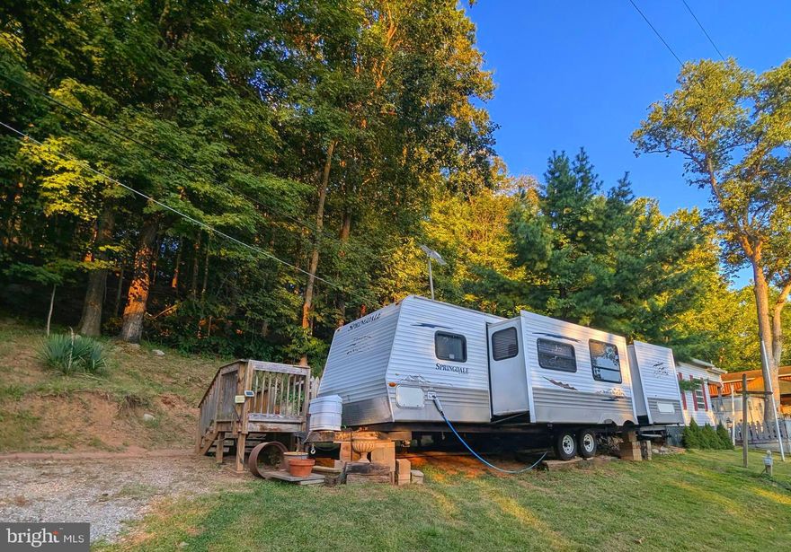 2008  29ft Springdale Travel Trailer with bunkhouse.  Golf cart included.   This lot is right across the street from the river lots. Parcel view of the river.  Backs to trees and no one on next to you because you are the last lot on that side.  

**** Let's bring an offer to the table! ***BRING YOUR BEST OFFER*** YOU WON'T WANT TO MISS THIS ONE.*** ** WELCOME TO RIVER BEND/SEASONAL LOT AVAILABLE TURN KEY** River Bend is a privately owned 400 acres recreational- vehicle camp resort with seasonal activities for members, families and guests. This great RV park is tucked away on the Upper Potomac River of West Virginia, River Bend is one of West Virginia's most popular family seasonal destinations. . Just a short drive from the Washington and Baltimore metro area. Open with utilities from April 1 to November 1. Lot owners have access to their property the entire year. *** Members Enjoy *** * Amazing views and wildlife, Potomac River access, Trails, Swimming pools, Mini-Golf, Youth center, Tennis and basketball courts, laundry facilities, convenience store, deli and lounge. *Bath houses through out the park, boat ramp, bar and grill and even a church located on the grounds. River Bend also hosts numerous activities such as 4th of July fireworks, small carnival, bonfires, poker runs, horseshoe tournaments, car show, Halloween Trick or Treat and so much more.