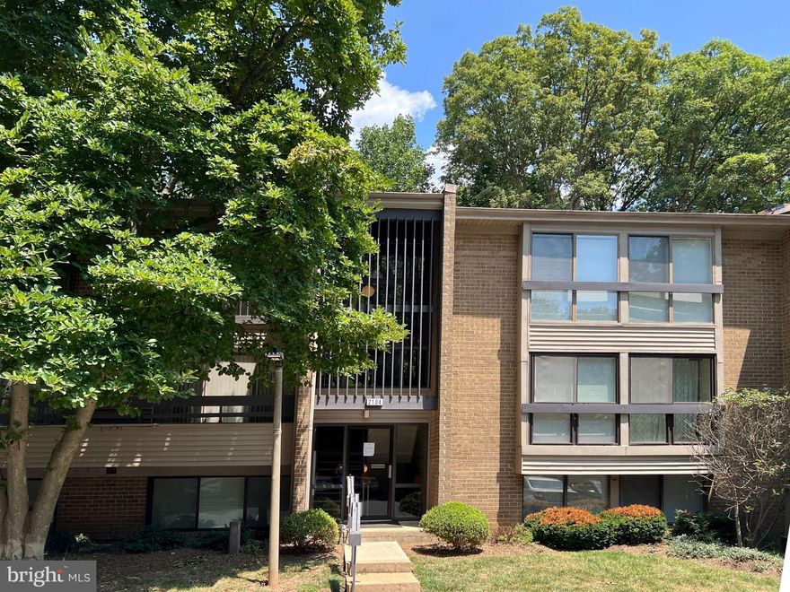 This exquisite Woodwinds condo offers the perfect blend of modern elegance and natural beauty.  The large balcony overlooks a lush, wooded area, providing a peaceful retreat for your morning coffee or evening relaxation.  Step inside to discover LVP flooring, added in November 2022, throughout, complimented by custom black metal balustrades.  The living room offers a stunning sloped ceiling, with recessed lighting and a black ceiling fan, creating a spacious and airy ambiance.  The living room's floor-to-ceiling windows, sliding glass door and screens  were replaced in June 2024.  The separate dining room is the ideal space for entertaining friends and family with a large glass space overlooking the woods.  The fully renovated kitchen boasts stainless steel appliances, custom 42" Shaker-style cabinetry, quartz countertops, a beautiful tiled backsplash and an eat-in space for casual dining.  The cabinets include a corner lazy susan, roll-outs and a spice cabinet.   The large primary bedroom offers double closets, generous windows and a completely renovated primary bathroom with high-end fixtures and finishes for a spa-like experience.  The secondary bedroom also has generous closet space and a large window.  A hall bathroom has been tastefully updated.  The washer and dryer are conveniently located in the hallway near the bedrooms, along with several storage closets.  A reserved carport in building 2, space 1 is just steps from the building's front door.   The entire HVAC system was replaced in November of 2023.  All interior doors and hardware, the ceiling fan, recessed lighting throughout, LVP flooring,  were replaced  in 2023.  The kitchen cabinets, stove with 5-burner cooktop and the dishwasher were replaced in October, 2020.    The entire interior was painted in 2023, creating a light, bright atmosphere.   In addition to the exceptional condo features, you'll have access to all of Reston's amazing, active lifestyle features – pools, tennis courts, pickle ball courts,  miles of scenic walking paths and two golf courses.  South Lakes Village Center,  Reston's Community Centers, Reston Town Center, Nature House and the Wiehle Metro stop (1.5 miles) are all nearby.   See this amazing property today to experience the perfect blend of modern updates in a spacious home and a community rich in amenities. Open house cancelled.