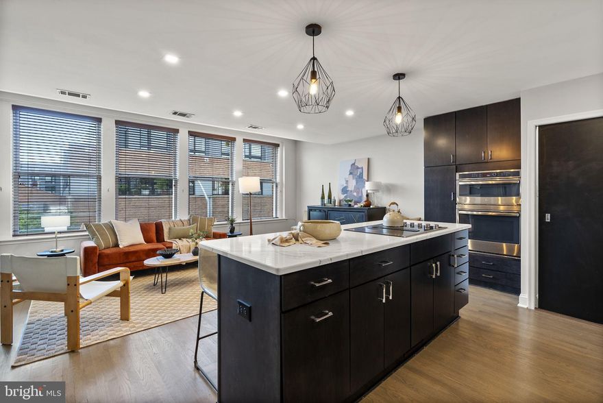 Welcome to your light-filled top-floor haven in the heart of historic Fell’s Point! This fully renovated 2 bed, 2 bath condo blends charm, style, and convenience — all just one block from the waterfront and promenade. Set on a classic cobblestone street, this premier top-floor unit offers sweeping city views from every room and the ease of private, dedicated parking (spot #7) in a private lot right behind the building.

Inside, natural light pours through abundant windows, highlighting the open-concept layout, walk-in closets, and built-in storage and shelving throughout. The renovated kitchen features sleek countertops, newer stainless steel appliances (2019), and flows effortlessly into the main living area, complete with a cozy fireplace — perfect for entertaining or relaxing.

Other upgrades include new lighting, HVAC, washer/dryer, oven, cooktop, and dishwasher (all 2019), plus a newer water heater (2018). The low HOA fee ($400/month) includes water, building insurance, common area electric, and maintenance — offering unbeatable value on a per-square-foot basis compared to neighboring properties.

With modern updates, historic charm, and an unbeatable location, this top-floor gem is your perfect city home. Don’t miss your chance to live in one of Baltimore’s most iconic neighborhoods — schedule your showing today!