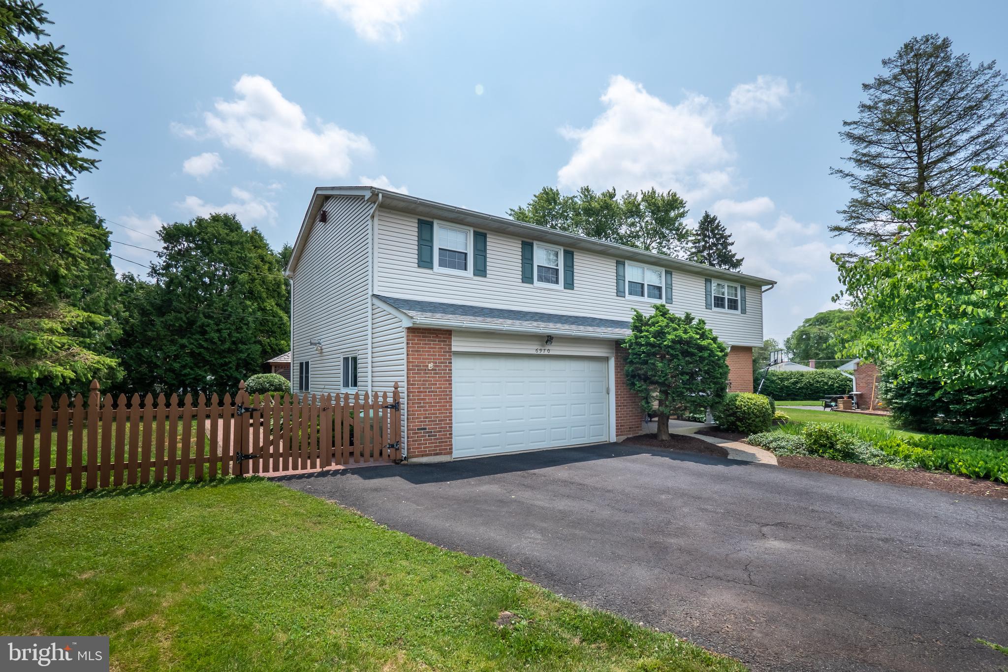 MULTIPLE OFFERS RECEIVED. Best and Highest due by 5p.m. 7/13/2020. Inviting open concept of living room, kitchen, and dining room. The living room features a gas fireplace, flanked with built-in cabinets; flowing into a modern kitchen with stainless steel appliances, gas stove, granite counters and a center island; open to the dining room with sliding doors that bring you onto the vast outdoor deck with awning overlooking a large partially fenced private yard with gazebo/shed. Back inside, off the kitchen is a 1/2 bath, and a few steps down is the office/rec room accessible to the 2 car garage and back yard. Upstairs has an expansive master en-suite that boasts two walk-in closets, laundry room with utility sink, radiant in-floor heating, and full bath with a jacuzzi tub. Completing the second floor are four generous size bedrooms and a recently renovated guest bathroom. This home also has a finished lower level with plush carpet and plenty of room for your storage.