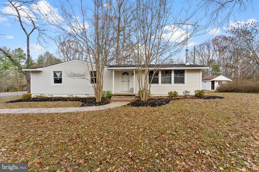 Rambler with 2.1 acres for sale in Nokesville VA.  Three bedroom, two bathroom home includes large rear Trex deck looking out into the woods, kitchen with dining area and spacious living room with wood burning stove. Other buildings on property include a detached one car garage and separate office that is ideal for working from home.  Property is tucked away in the woods near the Hamlet of Brentsville and has easy access to both Manassas and Woodbridge.  Bristow Rd is a home business friendly community.
