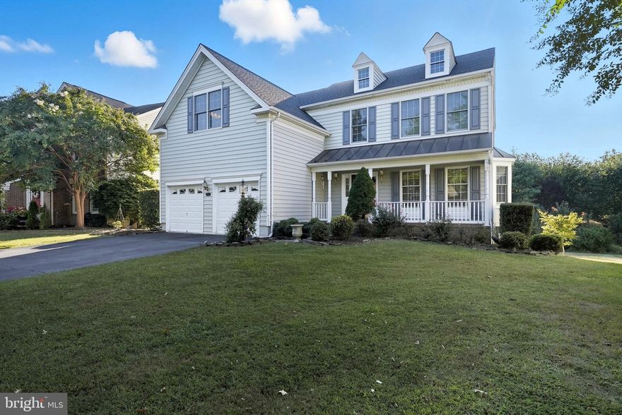 Check out the Virtual 3D Tour!  Don't miss your opportunity to take advantage of calling this meticulously maintained home your own in the highly sought after area of Dominion Valley!  Nestled nicely on just over a quarter of an acre, this four bedroom, 2 1/2 bath home was clearly well loved by its original owners.  As you enter the grand foyer, take note of the crisp detail, gleaming hardwood floors, and modern feel as you embark on your journey within the main level.  A formal sitting and dining room, cozy family area, home office, and nicely appointed kitchen leaves little to be desired.  Take note of the sizable deck that leads to an incredible view of open space, greenery, and lush trees.  Envision eating your favorite meal or entertaining friends and family, as you so easily transition from indoor to outdoor space on two levels.  With the cooler temperatures and holidays upon us, the family room adorned with a beautifully crafted fireplace and mantle, will serve to create lasting memories for years to come!  As you make your way up the magnificent staircase, lined with rustic wrought iron, the primary bedroom and bath emulates a private oasis, offering incredible spacing and warmth.  The remaining bedrooms and additional full sized bath can serve additional family quite comfortably - or the space can be nicely utilized for an office, sitting/craft room, and so much more!  As your journey continues to the walk-out basement, the size alone is impressive, and the excitement of letting your imagination be your guide as you think about all of the possibilities this canvas has to offer!  Let us also not forget the incredible location to popular commuting routes, nearby schools and shopping, and all that the Dominion Valley has to offer!