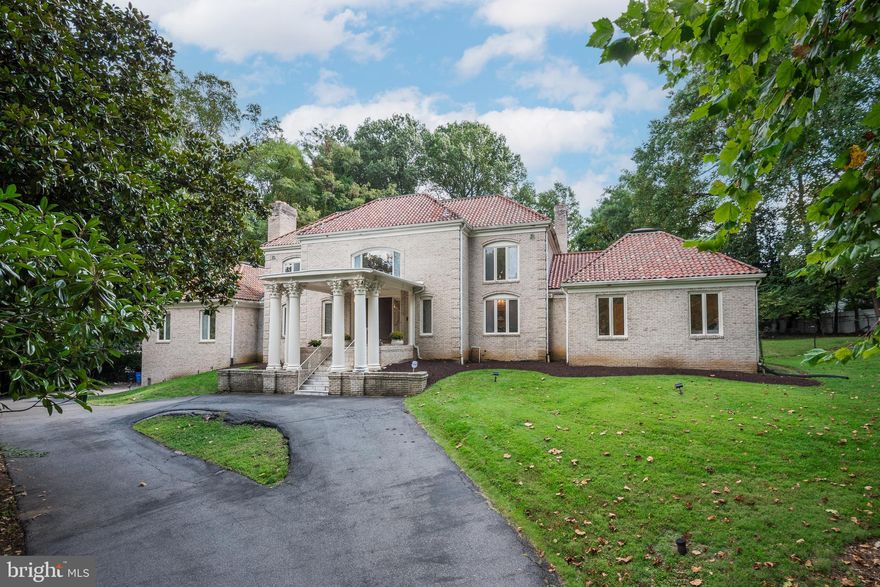 Presenting a rare opportunity to own this magnificent custom-built residence, nestled among prestigious homes in one of Potomac's most sought-after neighborhoods. This estate, on the market for the first time, offers the perfect canvas to update and create the home of your dreams. Every detail of this stately residence reflects exceptional craftsmanship and thoughtful design. A stunning marble foyer with a soaring two-story ceiling and a sweeping split staircase welcomes you inside, setting the tone for over 9,000 square feet of elegant living space. Ideal for grand entertaining and comfortable everyday living, the home boasts spacious formal living and dining rooms and a great room with vaulted skylight ceiling that floods the space with natural light. The main-level primary suite is a private retreat with a dressing room, two walk-in closets, and two luxurious en-suite baths, including a soaking tub, a walk-in shower, and water closet. Upstairs, you'll find five additional generously sized bedrooms, while the lower level offers a guest suite and abundant amenities. The fully finished walk-out lower level with 9-foot trey ceilings includes a family room, recreation and billiards rooms, second laundry room, full bath, and sauna bath with a jetted tub. Sitting on 2 acres of lush land, the outdoor spaces are equally impressive, with a large deck, patios, and swimming pool for your enjoyment. The dual gated entry, circular driveway, and three-car garage add to the estate's grandeur and privacy. While this home awaits your modern touch, its incredible scale, style, and timeless architecture present an unparalleled opportunity to create a truly spectacular residence.