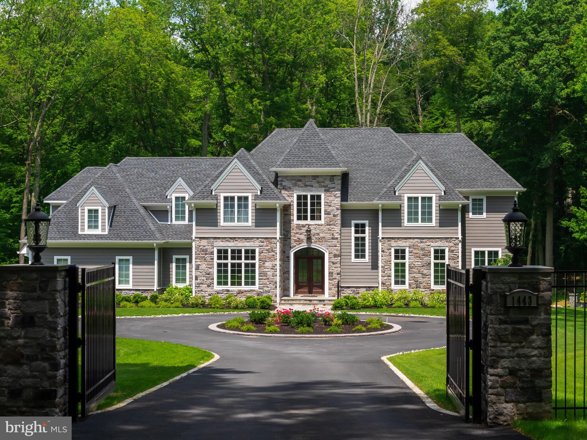 Welcome to 1443 Johnny's Way in the West Chester School District, Rustin High School. This unique design is a combination of vision by the owner/builder and Mark Stanish Architect's to create that one of a kind home on 3+ private acres.. This impressive 5 bedroom, 6 full and 1 half baths open design colonial has an easy flow for every day living or entertaining on the weekend. Step through the the double doors into the foyer where hardwood floors carry you to the Family room and open kitchen with views to the private back yard. The formal living and dining rooms are the perfect setting for that dinner party or holiday gathering. The kitchen is equipped with Jenn Air stainless steel appliances including a sub zero refrigerator , commercial gas range, dishwasher, microwave and beverage fridge. A large walk in pantry includes a built in desk to keep your lists and other devices off your kitchen counters. The breakfast room is set off to the side to create a nook to enjoy your coffee or tea before your day begins. The family room with the stacked stone gas fireplace also has a beverage fridge and wine fridge for your convenience. Entering from the garage is a convenient mud room with separate closets and hooks to keep coats, boots and sports equipment out of site. Coming in from work? There is the computer room/office steps from garage and back stairs where you can drop off your computer and files and head down the hall to relax. Each of the main first floor rooms have custom ceiling designs created by the builder. The second floor master bedroom suite with a cathedral ceiling has terrific views of the yard, stream and pond, two custom walk in closets with a wall safe and custom marble master bath. Two bedrooms with a shared bath, a private bedroom with full bath, a 5th oversized bedroom and full bath and a large laundry room complete the second floor. All of the baths have custom tile designs unique to each. The spacious lower level includes a great room with an entertainment bar and 2 beverage fridges, a gym, a bonus room and two full baths. Step outside to the blue stone patio with a built in grille. A few steps away is the fire pit overlooking the small pond for those moments of preferred solitude or gatherings with friends. The three car attached garage and 2 car detached garage in the side court yard solve that "were do I put the motorcycles or convertible in the winter" problem. This home was constructed by the builder as his own personal residence and the attention to detail is incredible. A must see for anyone looking for a true one of a kind custom home. Minutes to Downtown West Chester, shopping, route 3, route 202 and only 25 minutes to the Philadelphia Airport.