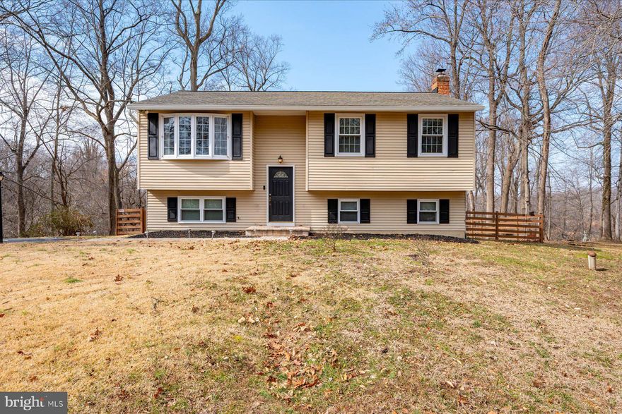 Set on just over 3.7 acres with views of Fishing Creek, this Chesapeake Beach property combines acreage, and water views. The main level includes three bedrooms, one full bath, a living room, dining room, and kitchen with access to the remodeled rear deck overlooking the creek.  The lower level features a finished family room with a pellet stove, walk-out access to a large fenced backyard, patio, and open yard space, along with an additional full bath, large storage space and laundry room.  Convenient to local beaches, waterfront restaurants, the Chesapeake Beach Resort & Spa and Casino, North Beach and offers reasonable access for commuters to Annapolis, Washington, D.C., and surrounding areas.