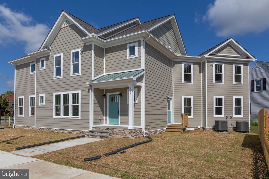 Discover the perfect blend of modern luxury and downtown convenience in this stunning brand-new 4-bedroom, 3.5-bath home by local builder Mersiovsky Construction.  Situated on a desirable corner lot, this residence offers thoughtful design details, upscale finishes, and rare off-street parking with a 1-car garage.
Step inside to find luxury vinyl plank flooring and crown molding throughout, paired with an abundance of natural light that fills every room. The main-level bedroom with en suite bath is perfect for guests or multi-generational living. The heart of the home is the gourmet kitchen, featuring upgraded GE Café stainless steel appliances, a 6-burner gas range, granite countertops, a stylish tiled backsplash, and a spacious island with seating—designed for both functionality and elegance. Upstairs, a versatile loft area serves as a possible second living room, offering flexible space for relaxing, entertaining, or working from home.  The primary suite is a true retreat, boasting a tray ceiling, dual walk-in closets, and a spa-like en suite with a soaking tub, walk-in shower, and dual vanity. This home showcases exceptional attention to detail, including a conditioned crawl space, a fully insulated garage with EV outlet, and quality craftsmanship throughout.  Additional bedrooms are generously sized, offering comfort and privacy for family or guests. All of this, just steps from the vibrant shops, dining, and charm of downtown Fredericksburg, with the commuter train station only blocks away for an easy trip to Northern Virginia or D.C.