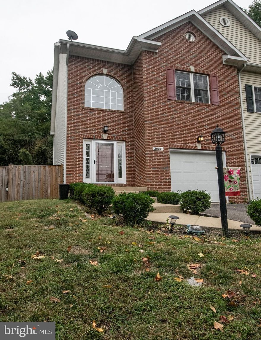 Beautiful 3 Level Townhouse with 2 Story Foyer.  Hardwood Floors on Main Level, Stairs, and Upper Hall.  Gourmet Kitchen and Extra Large Family Room with Gas Fireplace.  Upper Level has 3 Large Bedrooms, and 2 Full Baths.  Lower Level has Large Recreation Room and Full Bath.  Deck off Family Room, Fully Fenced Yard.  Freshly Painted.        NO CONDO OR HOA FEES.