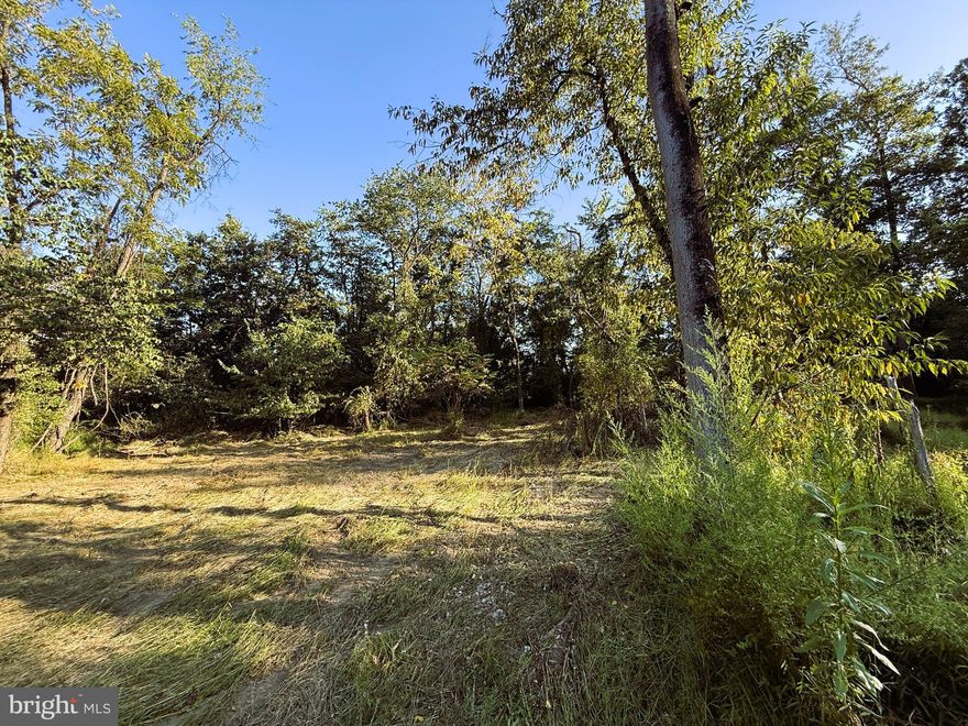 Discover the perfect setting for your dream home on this 5.09-acre lot in the desirable Greenwood Acres Subdivision.  The property offers a mostly flat, perked, survey stakes in place homesite.   Some clearing has been completed,making it easy to start your new build.  Enjoy the beauty of a serene wooded landscape with mountain views, while still having the convenience of a state maintained road with road frontage.  Located just 10 minutes from I-81 for easy commuting and 20 minutes from Berkeley Spring State Park.  Rather you are seeking a peaceful retreat or a permanent residence, this property provides both seclusion and convenience making it perfect for your New Home.