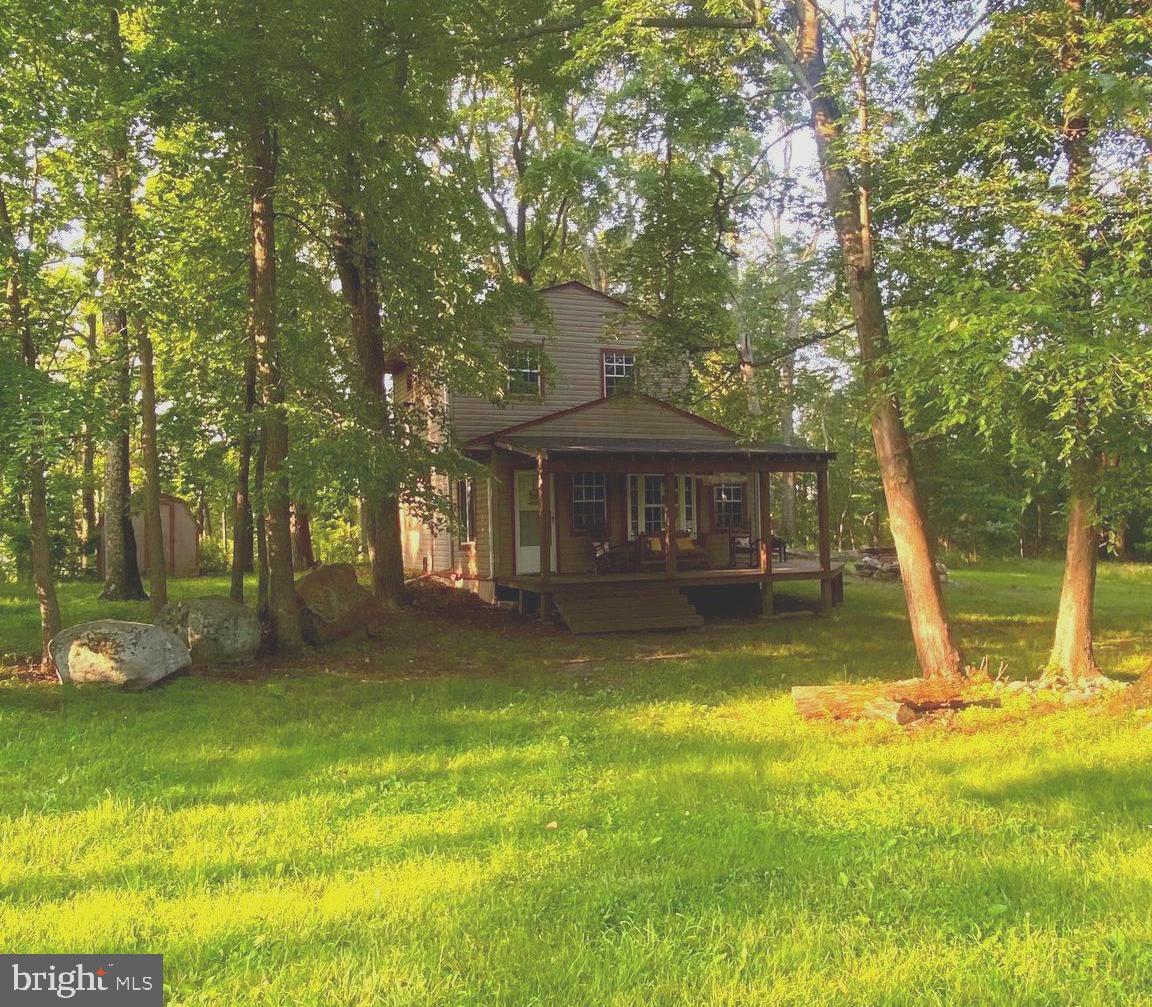Cozy Cabin Retreat in Wild, Wonderful West Virginia!
Here’s your chance to own a charming cabin tucked away in the scenic beauty of West Virginia! This home offers the perfect blend of privacy and convenience, with seclusion from the world yet close proximity to all the amenities this welcoming community provides.
Inside, you’ll find:
A cozy family room perfect for relaxing after a day outdoors
A beautiful kitchen featuring custom-made counter tops and a comfortable eating area
A full bathroom with tub located on the main floor
Outside highlights include:
A spacious deck, ideal for a hot tub or outdoor dining
Two large outbuildings for storage, workshops, or hobbies
A flat yard—great for a pool, games, entertaining, or simply enjoying the outdoors
This property is versatile enough to serve as a full-time residence, a weekend escape, or a profitable Airbnb rental. Don’t miss this opportunity to own your very own piece of West Virginia paradise!