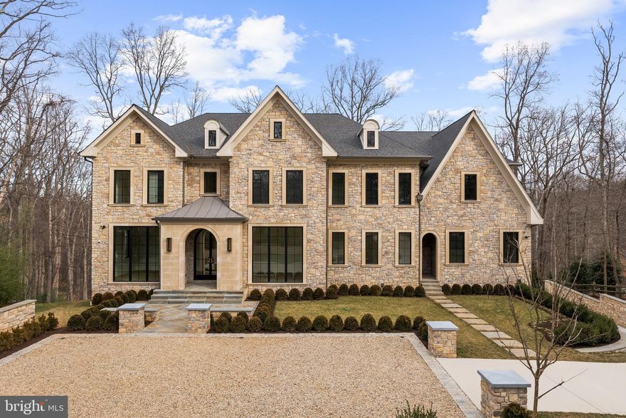 Crafted with uncompromising attention to detail, this extraordinary new construction estate by Lavenir Custom Homes with interiors thoughtfully curated by Boxwood Living - stands as a refined masterpiece of architectural elegance.

Set on 1.46 private acres and spanning 11,471 square feet, the residence is introduced by a striking façade of light-toned stone and brick, a custom-designed drive, and a lantern-lit front portico that establishes an immediate tone of timeless sophistication.

Inside, a dramatic 22-foot foyer and architecturally sculpted curved floating staircase create a breathtaking first impression. The main level flows through refined yet inviting spaces: an elegant sitting room bathed in natural light, a formal dining room elevated by bespoke millwork, and an expansive great room framed by floor-to-ceiling windows that embrace serene views of the manicured grounds.

At the heart of the home, the show kitchen by Lobkovich showcases a commanding 14-foot rift-cut white oak island, fully paneled appliances, a discreet secondary prep kitchen, and a generous walk-in pantry - equally suited for everyday living and grand-scale entertaining.

Upstairs, the luxurious primary suite offers a private balcony, a spa-inspired marble bath with dual vanities and soaking tub, and generous custom walk-in closets. Four additional bedroom suites provide exceptional privacy and comfort, each with ensuite baths and tailored closets.

The lower level elevates leisure and wellness with a temperature-controlled wine cellar, full gym with sauna and steam shower, intimate theater, fireside lounge, and fully appointed wet bar - ideal for unwinding or hosting with ease.

Outdoors, the experience rivals that of a boutique resort. A serene setback pool and spa anchor the property, complemented by a beautifully appointed pool house and covered patio with fireplace and shiplap ceiling, designed for effortless year-round enjoyment

A four-car garage and professionally curated landscaping by Wheat’s Landscape complete the estate. A rare fusion of exquisite craftsmanship, refined interiors, and resort-inspired amenities, this residence stands as a statement of enduring elegance and distinction.

Welcome to 8634 Overlook.