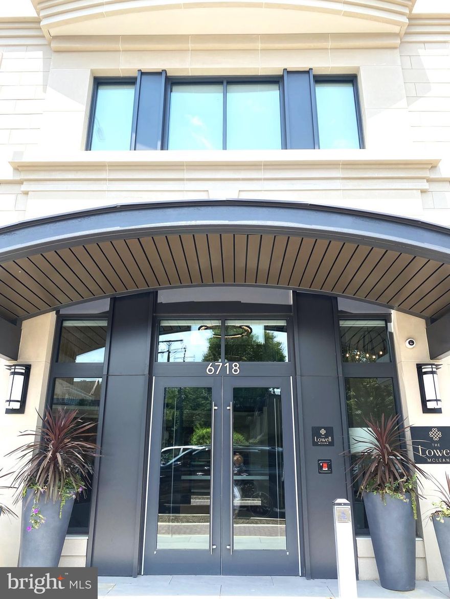 Welcome to this light-filled, never-lived-in condo on the seventh floor of The Lowell, a luxury boutique condominium community in the heart of McLean. This elegant residence offers just under 2,000 square feet of open-concept living with 9-foot ceilings and wide-plank hardwood flooring throughout.
The spacious layout includes 2 bedrooms, 2 full bathrooms, and a versatile den—perfect for a home office or guest space. A gracious entry foyer leads to a sun-drenched great room ideal for entertaining or quiet evenings at home. A wall of glass opens to a private balcony with sweeping views from an elevated vantage point.
The adjacent dining area comfortably fits a table for eight, creating an inviting space for formal dinners or casual gatherings. Across from the dining area, the gourmet kitchen features premium Miele stainless steel appliances, quartz countertops and backsplash, a large island with bar seating, and abundant storage.
Retreat to the serene primary suite with a spa-inspired ensuite bathroom showcasing a double-sink vanity, a luxurious glass-enclosed shower with designer tile, heated floors, and a customized walk-in closet with built-in drawers and shelving. The second bedroom, located on the opposite side of the unit for added privacy, also features a spacious walk-in closet and easy access to a second full bathroom with a modern soaking tub.
Additional highlights include a dedicated laundry room with full-size front-loading washer and dryer, two assigned garage parking spaces, and a private storage unit on the parking level.
Community Amenities:
Residents of The Lowell enjoy access to a curated selection of on-site amenities, including a state-of-the-art fitness center, multiple stylish club rooms, a beautifully landscaped courtyard with gas grills, dining areas, firepits, and a two-story lobby with concierge service.
Prime Location:
Just over 2 miles from the McLean Metro Station and within walking distance (0.3 miles) to the McLean Shopping Center, Balducci’s, Giant, Starbucks, and an array of restaurants and retail. Reagan National Airport is less than 13 miles away, making travel easy and convenient.
Experience elevated living in one of McLean’s most desirable new communities. Schedule your private tour today!
Note: There is a no pet and non-smoking policy on this property.