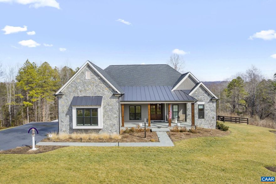 Built in 2024 and set on 6 elevated acres in Fair Hill Mountain Estates, this Crozet home offers refined one-level living with exceptional custom finishes throughout. Bluestone sidewalks and porches, natural stone exterior accents, and a mahogany front door create a striking first impression. Inside, an elegant foyer and dining room lead to a soaring vaulted great room with exposed beams, floor-to-ceiling fireplace surround, custom built-ins, and walls of Pella windows flooding the space with natural light. The kitchen is a true centerpiece, featuring a 10? waterfall island, breakfast nook with built-in bench, and seamless flow to a vaulted screened porch?perfect for relaxing or entertaining. Engineered wood floors span the main level, which includes a luxurious primary suite with tray ceiling and spa-inspired bath with oversized shower and herringbone tile detail, plus two additional bedrooms with private baths on the opposite site of the home. The terrace level offers an expansive rec room with wet bar, two more bedrooms and full baths. Three-car garage, fenced yard space, energy-efficient construction, and thoughtful attention to every detail complete this remarkable home.,Fireplace in Family Room
