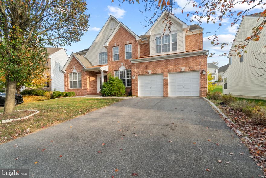 Stunning colonial home situated on a cul-de-sac in Worthington Fields, offering exceptional curb appeal with its blend of brick and vinyl siding, complemented by well-maintained landscaping. Step inside to a spacious, open-concept interior that exudes elegance, featuring gleaming hardwood floors, refined crown moldings, and an abundance of natural light that floods every corner of the home. 

Enter through the grand foyer, where the formal living room greets you to the left. To the right, the elegant dining room catches the eye with its raised ceiling, intricate detailing, and striking chandelier. The space is further enhanced by a classic chair railing and wainscoting, adding a touch of sophistication.  Moving forward, you'll pass a chic and convenient powder room, along with a well-appointed study enclosed by French doors. Continue into the inviting family room, where a gas fireplace serves as the focal point. An expansive transom window opens into the open-concept eat-in kitchen, creating the perfect setting for seamless dining and entertaining. The kitchen is a chef’s dream, fully equipped with stainless steel appliances, a gas range, gleaming granite countertops, a center island with seating, a large pantry, eclectic pendant lighting, and a chic subway tile backsplash. The space includes a breakfast bar and a cozy breakfast area for casual meals, with direct access to the garage and the laundry room for added convenience. Adjacent to the kitchen, a sunlit breakfast or sunroom boasts panoramic windows, a vaulted ceiling, and exterior access. 

The upper level impresses with a lofted hallway, 2 full bathrooms, and 4 generously sized bedrooms, each featuring plush carpeting and ample closet space. The opulent owner’s suite is a true retreat, showcasing soaring cathedral ceilings and 2 closets, including an oversized walk-in. The bright en suite bathroom offers a spa-like experience with dual vanities, a large corner soaking tub, and a separate shower complete with a built-in bench. The fully finished lower level is an entertainer's dream, featuring a spacious, open recreation room with luxury vinyl tile floors, a convenient kitchenette, a full bathroom, and walk-up exterior access. Additionally, the lower level offers 3 versatile bonus rooms each with its own closet. Step outside to a gorgeous, large composite deck ideal for alfresco dining, which gracefully steps down to a spacious, open backyard—perfect for outdoor activities and gatherings.

Worthington Fields is a peaceful community that combines suburban charm with convenience. Residents enjoy common grounds, a clubhouse, a community pool, tot lots/playgrounds, as well as nearby shopping, dining, and easy access to major commuter routes like Route 29 and I-70 for quick travel to Baltimore and Washington, D.C.