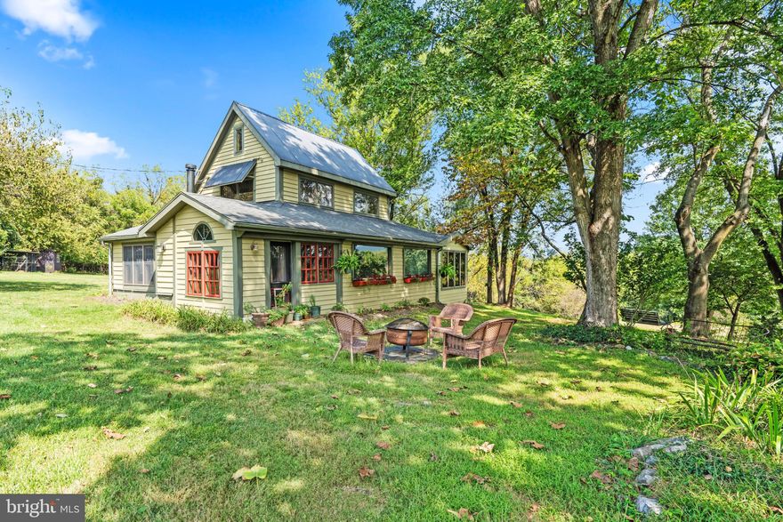 Beautiful Hobby Farm Retreat!
Nestled between historic Shepherdstown and Harpers Ferry, this custom timber-frame style home offers 1,695 sq. ft. of rustic charm with exposed mortise and tenon joinery. Enjoy breathtaking views of the MD and VA mountains where the Potomac and Shenandoah Rivers meet.

Set on 4 private acres with open fields, wooded areas, gardens, fruit trees, and a greenhouse, the property is ideal for animals or agricultural use. Relax on the covered porch, decks, or patio, and unwind by the firepit or outdoor shower.

The home features a flexible floor plan with cozy woodstoves, mini-splits, wood floors, and a custom kitchen with butcher block counters, farmhouse sink, propane stove, and filtered drinking water. The main level includes a tiled walk-in shower, while the spacious upper-level master suite offers a soaking tub, unique barnboard vanity, laundry, and loft storage. Additional highlights include a metal roof, updated plumbing and electric, and a gated driveway.

Large 2-story bank barn with solid metal roof and separately metered and offering a workshop (1536 SF, with water and electric)  on the lower level and upper-level storage with potential for apartment conversion. Additional outbuildings include tractor sheds, garden shed, barn carport, and an extra carport that could serve as a run-in shed. Property offers abundant wildlife including deer, turkeys, foxes, rabbits, and a variety of birds. Conveniently located near the MARC train, and within easy distance to Leesburg, Frederick, Winchester, Purcellville, wineries, breweries, historic landmarks, and outdoor recreation along the C&O Canal and Shenandoah River.

A truly unique, well-maintained property with no zoning restrictions—perfect for a hobby farm or private retreat!