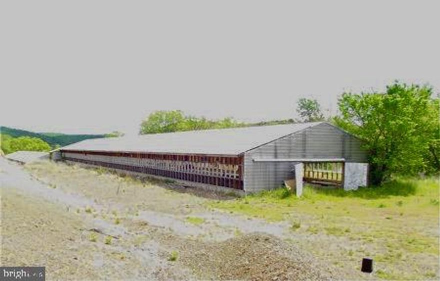 WV RTE #46 - CENTRALLY LOCATED BETWEEN KEYSER AND FORT ASHBY, FORMER POULTRY FARM. (2) MASSIVE 42' X 262' METAL COVERED BUILDINGS CONTAINING 22,880 SQ. FT FOR INDOOR STORAGE. WELL WATER, ELECTRIC, CONCRETE AND GRAVEL FLOORS. LARGE COMMERCIAL LOT WITH LONG ROAD FRONTAGE FOR SIGN DISPLAY.  E-Z ACCESS.