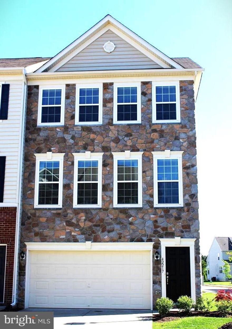 **Welcome to this gorgeous END UNIT TOWNHOME situated in a charming  PROVIDENCE GLEN neighborhood, featuring  replaced roof,  Replaced A/C,  refinished hardwood flooring  is ready for you to move in. This three-level townhome includes a front two-car attached garage and is conveniently located near Dulles South Recreation and Community Center. This beautifully designed 3-bedroom, 3-full-bath, and 1-half-bath townhome showcases a spacious, open floor plan! The large eat-in kitchen comes with stainless steel appliances! Beautiful hardwood flooring and plenty of natural light enhance every room in the home. The master suite features  walk-in closet and a specious master bath. Laundry is conveniently situated on the bedroom level. The basement has a Full bath with a recreation room and a Flex room. Enjoy a spacious deep deck and concreate patio, along with a concreate Side walk and a  beautifully fenced backyard . The home is just a Two-minute drive to Park & Ride, within walking distance to various Stores, a ten-minute drive to the airport, and only minutes drive from all shops and movie theatres.