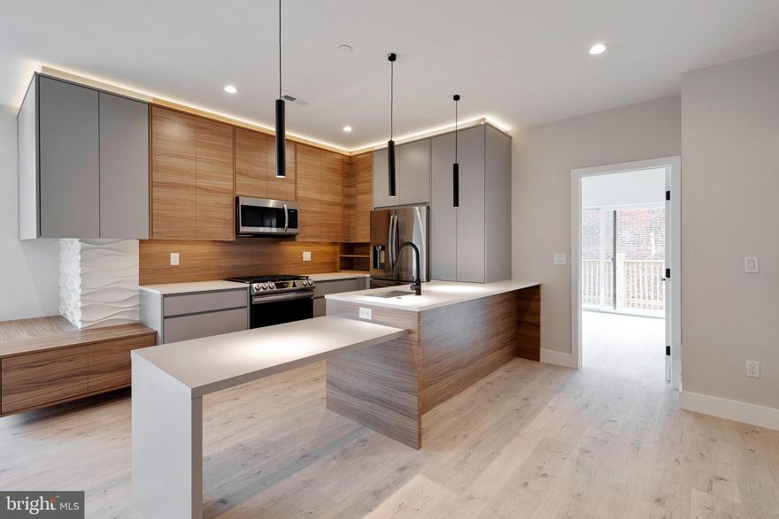 Newer construction, luxury 2 bed, 2.5 bath apartment in prime Point Breeze location now available for rent! Deck off of the bedroom! At over 900 square feet, this unit features top of the line finishes, high end appliances and because it's on a corner, you have extra windows that bring in a ton of sunlight! This unit also has an extra massive living space on the lower level. This apartment boasts hardwood flooring throughout, has 9 foot ceilings, modern kitchen w/ stainless steel appliances including a dishwasher, quartz counter tops, slow closing cabinets and a gorgeous backsplash w/ a breakfast bar. For convenience this apartment also includes a washer and dryer in unit! All bedrooms feature hardwood flooring, large closets and recessed lighting. Full bathrooms with beautiful tile throughout, shower and vanity. Prime location with easy access to restaurants, shopping, schools, public transportation and much more and close to I-76 and I-95! Schedule your showing today! Renter responsible for all utilities. $50 flat fee for water. First months rent and two months security deposit due upon lease signing. Pets will be considered on a case to case basis. Photos from prior to current tenant occupancy.