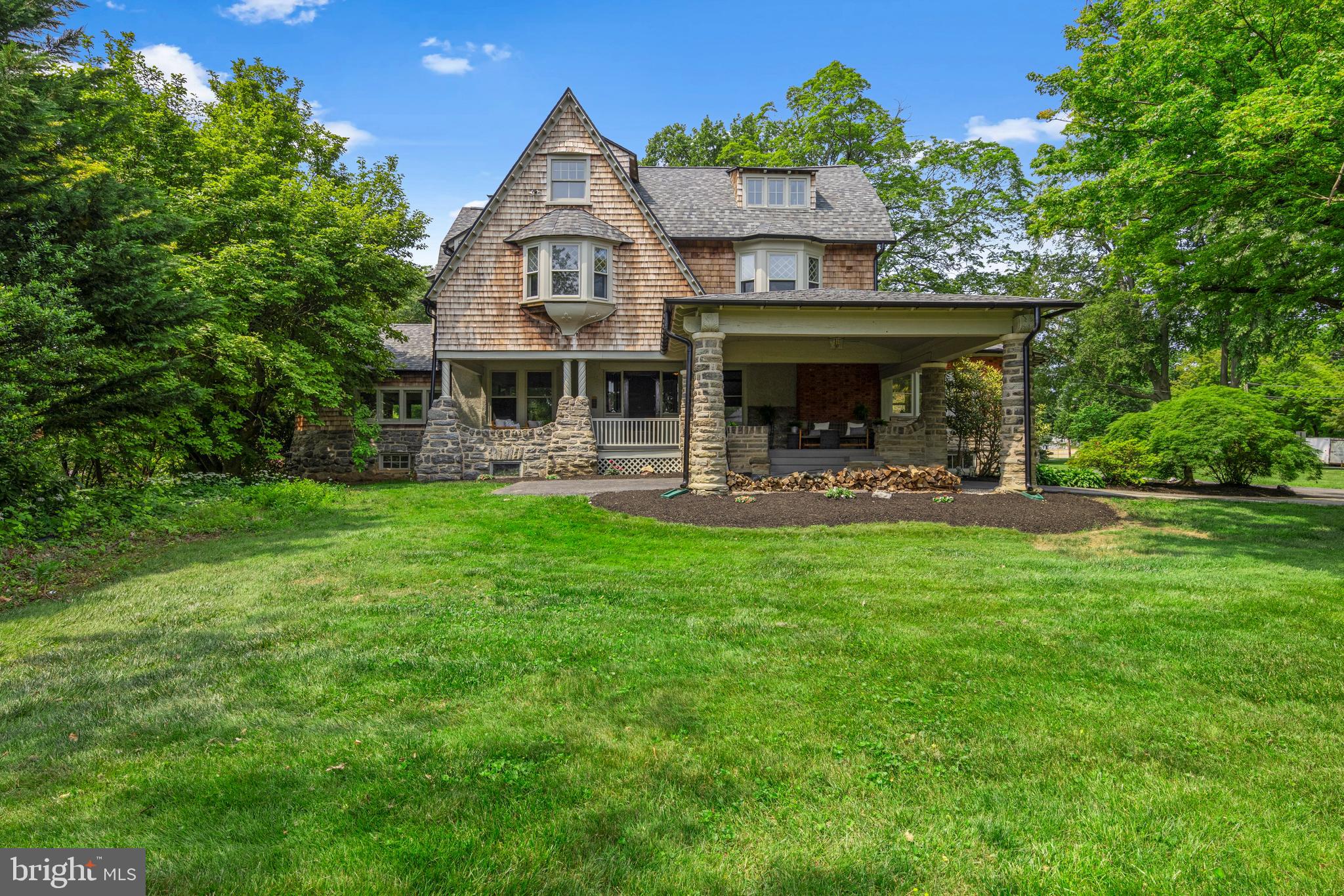 Step into a bygone era where homes featured charming porches, spacious rooms, and cozy fireplaces. This extraordinary residence offers all of that and more! Here lies your chance to own a piece of Wayne’s rich history in the desirable neighborhood of North Wayne, a district proudly listed on the National Register of Historic Places. Originally built in 1887, “Oak Knoll” was the private residence of Herman Wendell, a visionary developer in suburban Philadelphia, this home showcases the craftsmanship behind many of the remarkable houses erected in North and South Wayne during the late 19th and early 20th centuries. Designed by the acclaimed architect Horace Trumbauer, Oak Knoll is beautifully set on a nice corner lot adorned with mature landscaping.
This captivating 19th-century masterpiece exudes timeless elegance and character, just a short stroll from downtown Wayne. Upon arrival, you’ll be greeted by a covered portico and an inviting front porch, perfect for relaxing or entertaining. Inside, a grand staircase in the original oak-paneled foyer beckons you to explore the charming second floor. The foyer impresses with its elegant design and exquisite millwork. A cozy parlor with a fireplace leads to a sophisticated office, known as the “Truce Room,” featuring a striking stone fireplace. To the opposite side of the foyer, you’ll find a sun-drenched, spacious family room. The expansive formal dining room, complete with intricate millwork, a glass-door cabinet, and a stylish fireplace, sets the stage for unforgettable gatherings. The eat-in kitchen boasts a rustic butler's pantry with original cabinetry, offering endless possibilities for renovation—create your dream kitchen, add another home office, or expand your storage.
The second floor introduces six generous bedrooms, two full baths, and a convenient laundry room, inviting you to envision the fireside primary suite of your dreams with the help of your designer. The bright third floor presents versatile space for additional bedrooms or suites, ideal for an office, a teenage retreat, or au-pair accommodations. This level also features a half bath, a freestanding tub, and a cedar closet for your storage needs.
Recent significant upgrades include a new high-efficiency HVAC system, electrical rewiring with a modern panel, a new 35-year roof, a newly renovated hall bath, and foundation waterproofing for a dry basement, ensuring this home is ready for its next chapter.
Take leisurely strolls along tree-lined streets to downtown Wayne, where you can indulge in its many amenities. This home embodies both grace and comfort. Don’t miss the opportunity to tour this unique property and own a piece of Wayne’s storied past! Professional photos of the 2nd and 3rd floors will be coming soon.