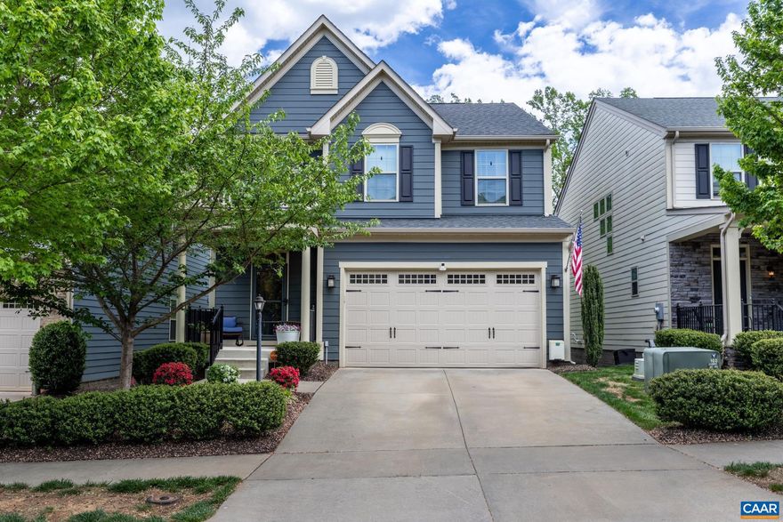 Welcome to this upgraded Craftsman-style home in the sought-after Cascadia community of Charlottesville! Built in 2019, this 4-bedroom, 3.5-bath home offers over 2,800 sq ft of well-designed living space with modern finishes throughout.  The open-concept layout features granite countertops, a large island, custom cabinetry, under-cabinet lighting, and upgraded appliances. The spacious living area includes a striking stone gas fireplace, while tray ceilings and recessed lighting add a polished touch. The primary suite offers an upgraded bath, double vanity, and walk-in closet.  The finished walk-out basement with full bath provides flexible space for guests, office, or recreation. Enjoy outdoor living with an extended deck, covered patio, and front balcony. Elevated lot offers added privacy.  Additional features include a 2-car garage, dual-zone HVAC, tankless water heater, fiber internet, and security system. HOA amenities include pool, clubhouse, playgrounds, and more.  Convenient to shopping, dining, and downtown Charlottesville.