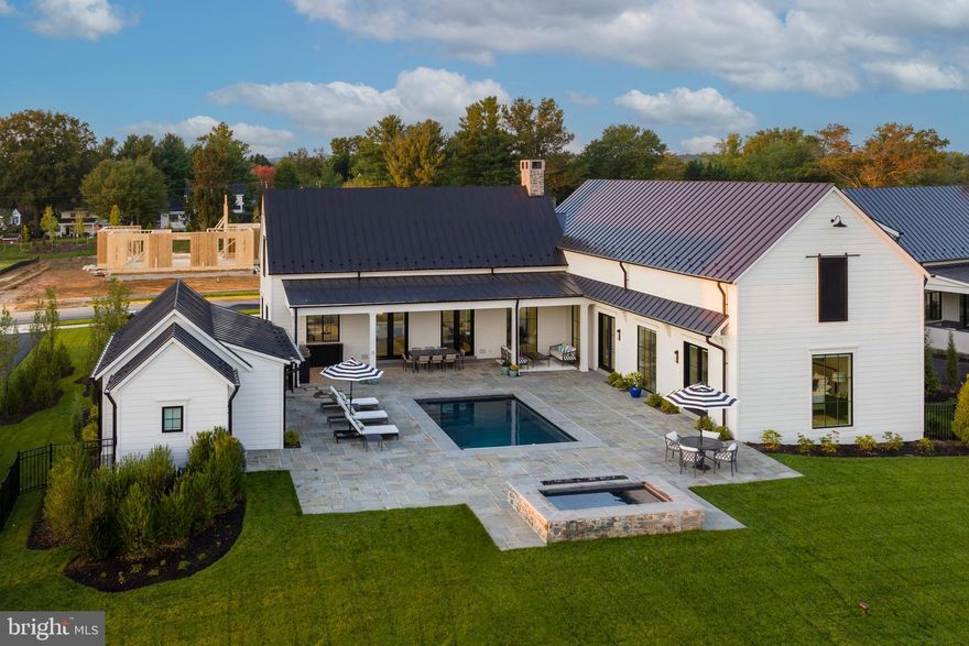 Set against 200 acres of protected conservation land, 604 Martingale Ridge Drive offers a rare balance of privacy, design, and ease within the exclusive Residences at Salamander. Just over an hour drive from Washington, DC, the home is oriented around light, landscape, and indoor–outdoor living, with floor-to-ceiling windows framing a private courtyard, pool, and garden, and long views beyond. It is a residence designed for effortless weekends and extended stays—refined, tranquil, and seamlessly connected to one of Virginia’s most celebrated resort destinations.  

The exclusive Residences at Salamander were conceived by Sheila Johnson to be an intimate collection of luxury homes woven into the celebrated 340-acre Salamander Middleburg resort. Surrounded by protected woodlands, streams, and miles of riding, walking, and biking trails, the property offers rare privacy with sweeping pastoral views and a Blue Ridge Mountain backdrop, all just moments from the charm of downtown Middleburg. City meets country in a most sophisticated yet casual way.  The walkability to both the Resort , the spa, along with all the shopping and restaurants in charming town of Middleburg make this a singular retreat. 

Upon entering the home, you are greeted by a dramatic great room crowned by a soaring 16-foot cathedral ceiling with wood beams. Instantly, your eye is drawn upward—and then outward—to a glorious courtyard enclosed by the wings of the house, with 200 acres of protected woodland beyond. You hardly know whether to step inside or out; it is all so lovely. Back inside, the great room is beautifully articulated into a living area with fireplace, a dining space overlooking the professionally landscaped courtyard, pool, and garden, At the far end is the elegant breakfast bar and behind a gourmet kitchen with everything you need. Everyone can gather here, yet the room offers countless places to settle in and enjoy the space. Custom details include wood ceiling beams, a handsome dry bar with wine refrigerator, and refined designer lighting throughout.

The first floor also features a fireside den with full bath and a serene primary suite with direct access to the pool, spa, and private courtyard and another guest space. Upstairs, two light-filled ensuite bedrooms offer enhanced ceiling heights and a charming reading-nook landing. The lower level includes two additional bedrooms, two full bathrooms, and a very large generous, flexible media and game room ideal for entertaining, also there is connected storage room.

The outdoor courtyard is a world unto itself, with inviting spaces to dine, read, lounge in the sun, or dangle your feet in the pool. Outdoor amenities include a large heated saltwater pool and an 8' x 8' spa. The current owners converted the garage into a carpeted pool house for lounging, hosting a party or making it a small bedroom; as it is equipped with full bath. The multiple stone terraces, a grill center, and the ease to walk the resort property from your own back yard is sublime. With six bedrooms and seven-and-a-half baths, this is an unparalleled opportunity to experience luxury living at the Residences at Salamander, along with full access to the amenities of the Salamander resort in one of Virginia’s most celebrated destinations.